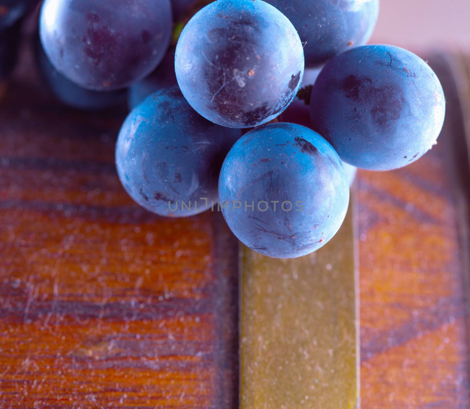 Black grape over barrell, close up