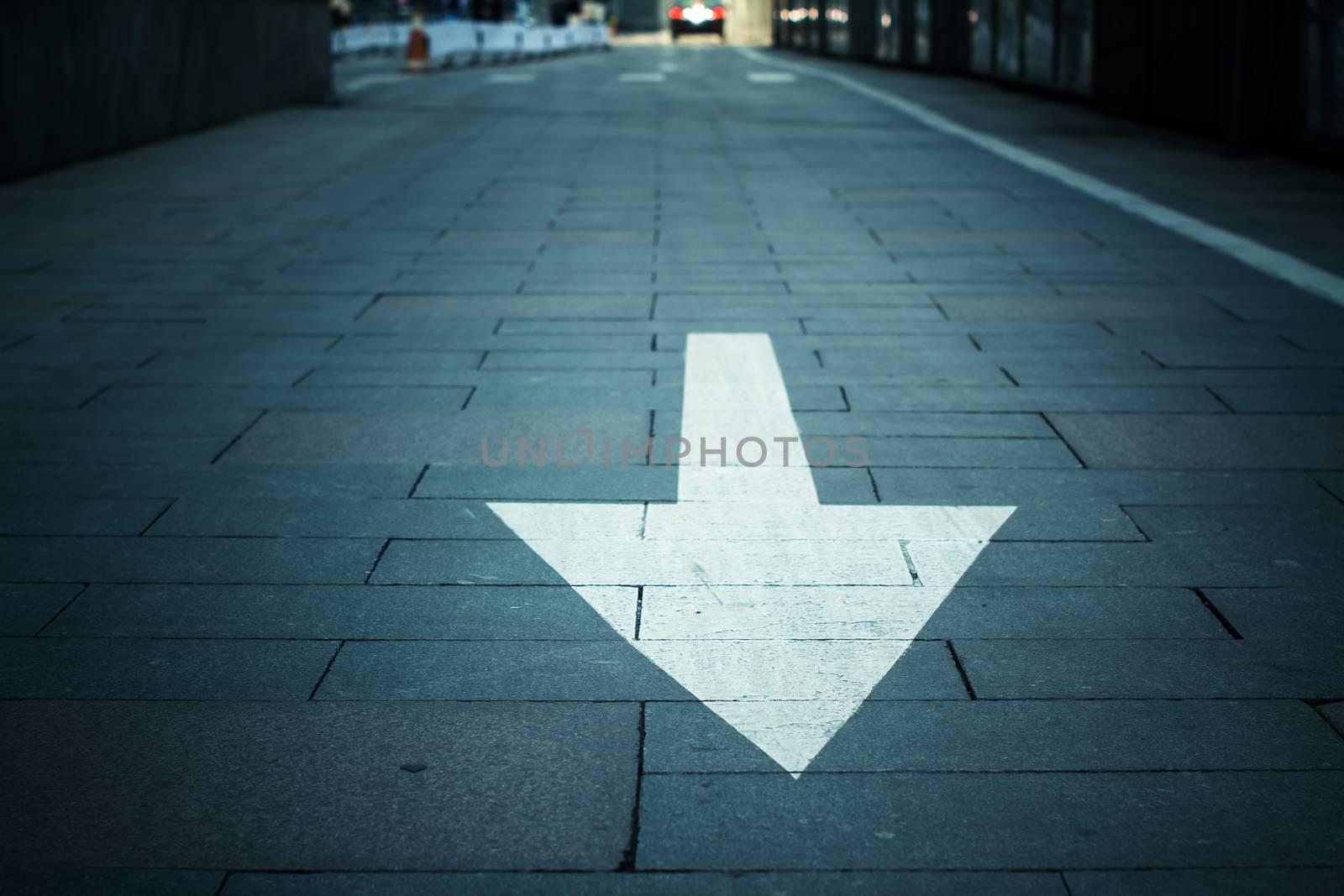 arrow on the road in city