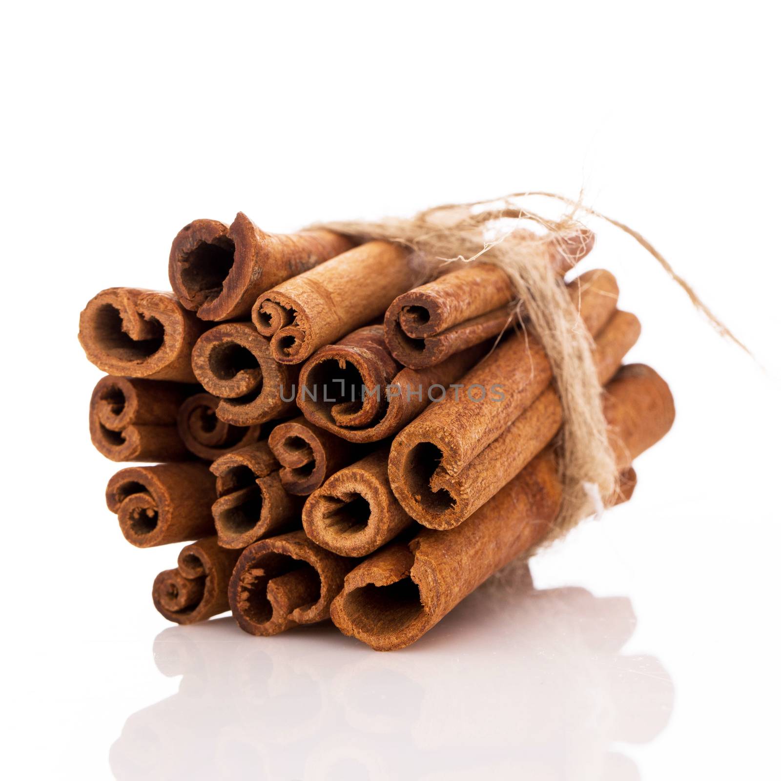 Stack of cinnamon over a white background