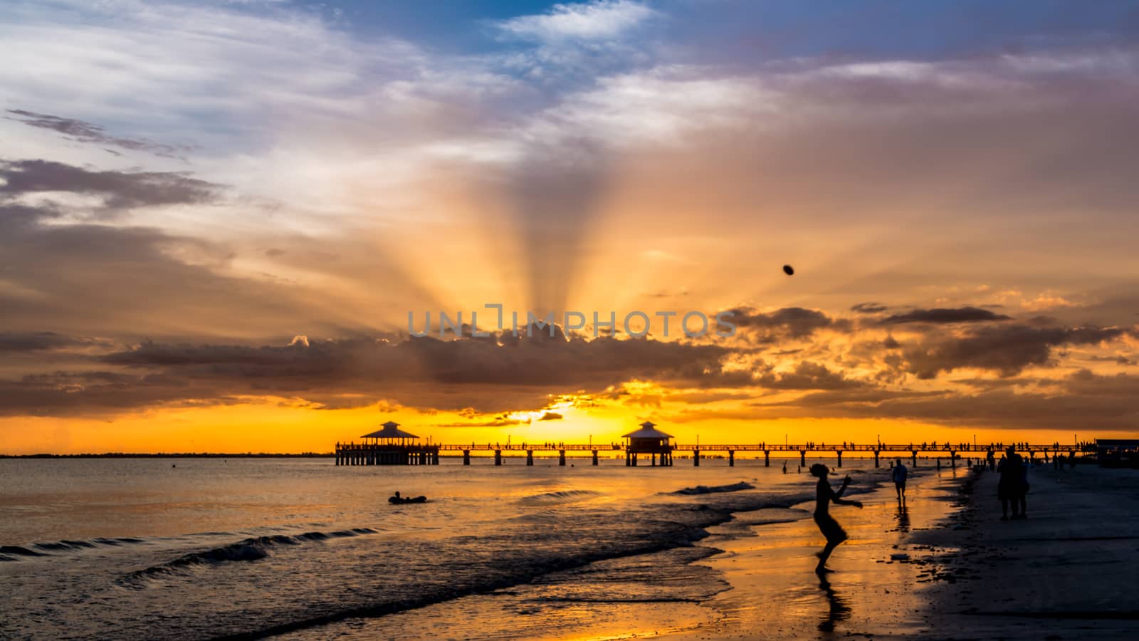 The beautiful sun setting on the shores of Fort Myers Beach located on Estero Island in Florida, United States of America