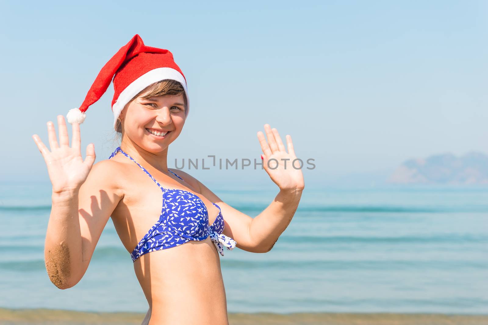 portrait of a girl in a cap of Santa Claus