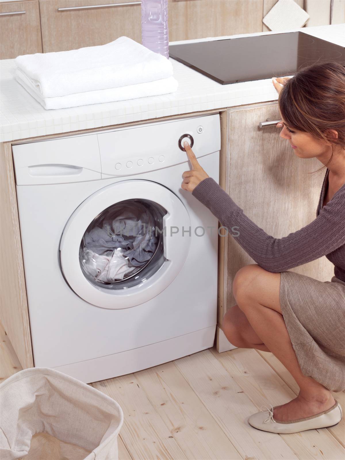 pretty smiling woman in the laundry room 