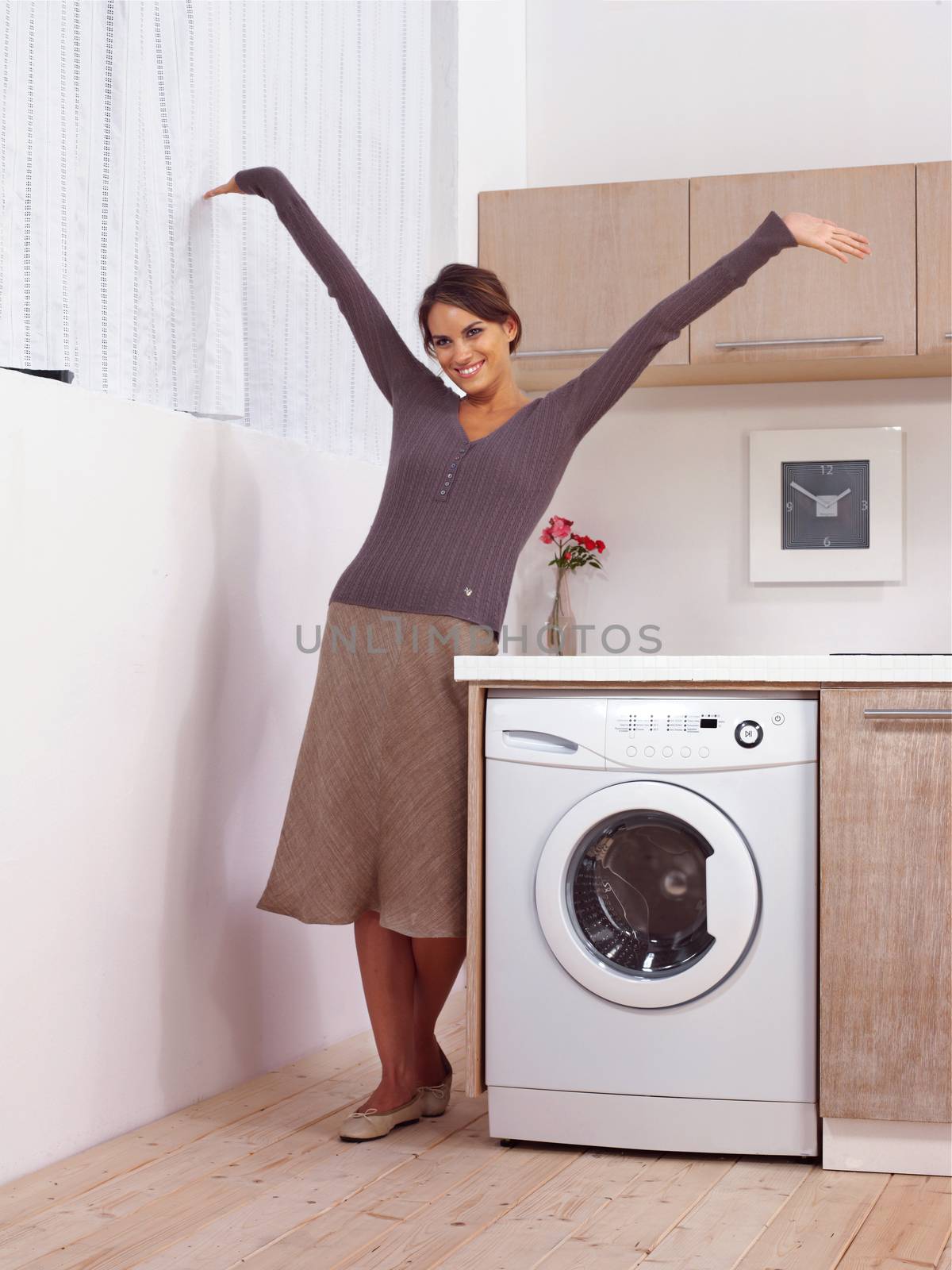 woman in kitchen near washing machine 