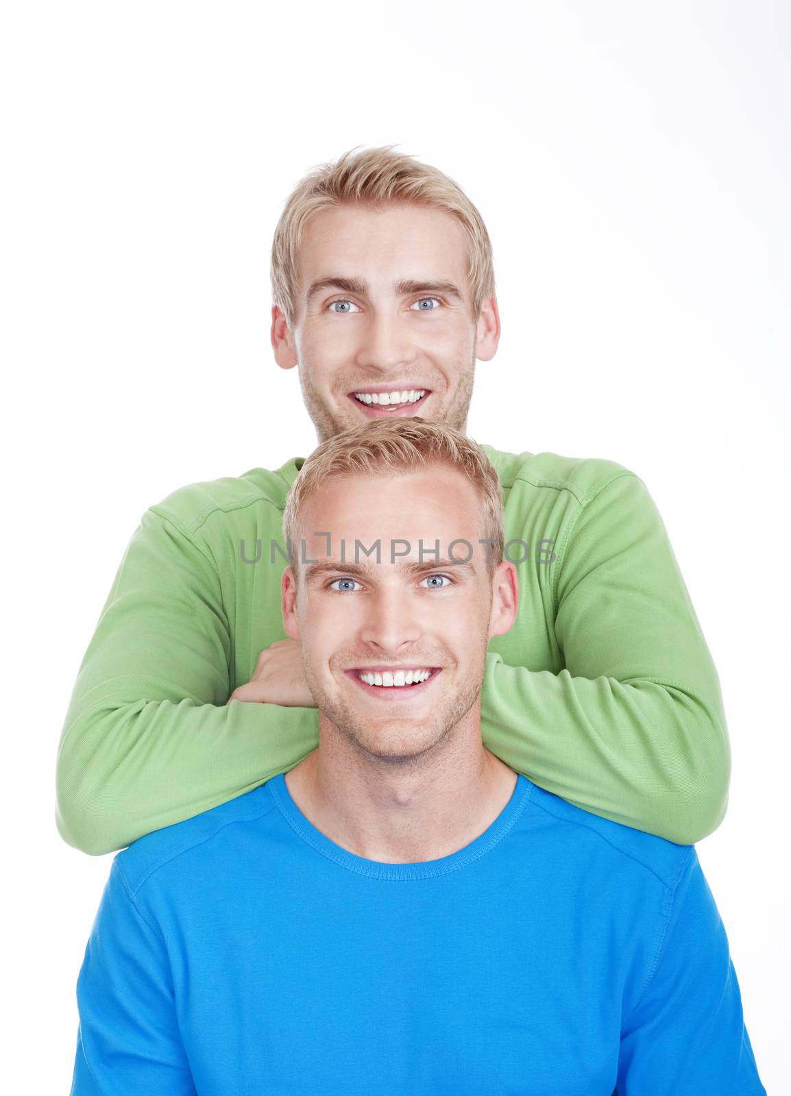 portrait of young twin brothers with blond hair and blue eyes - isolated on white