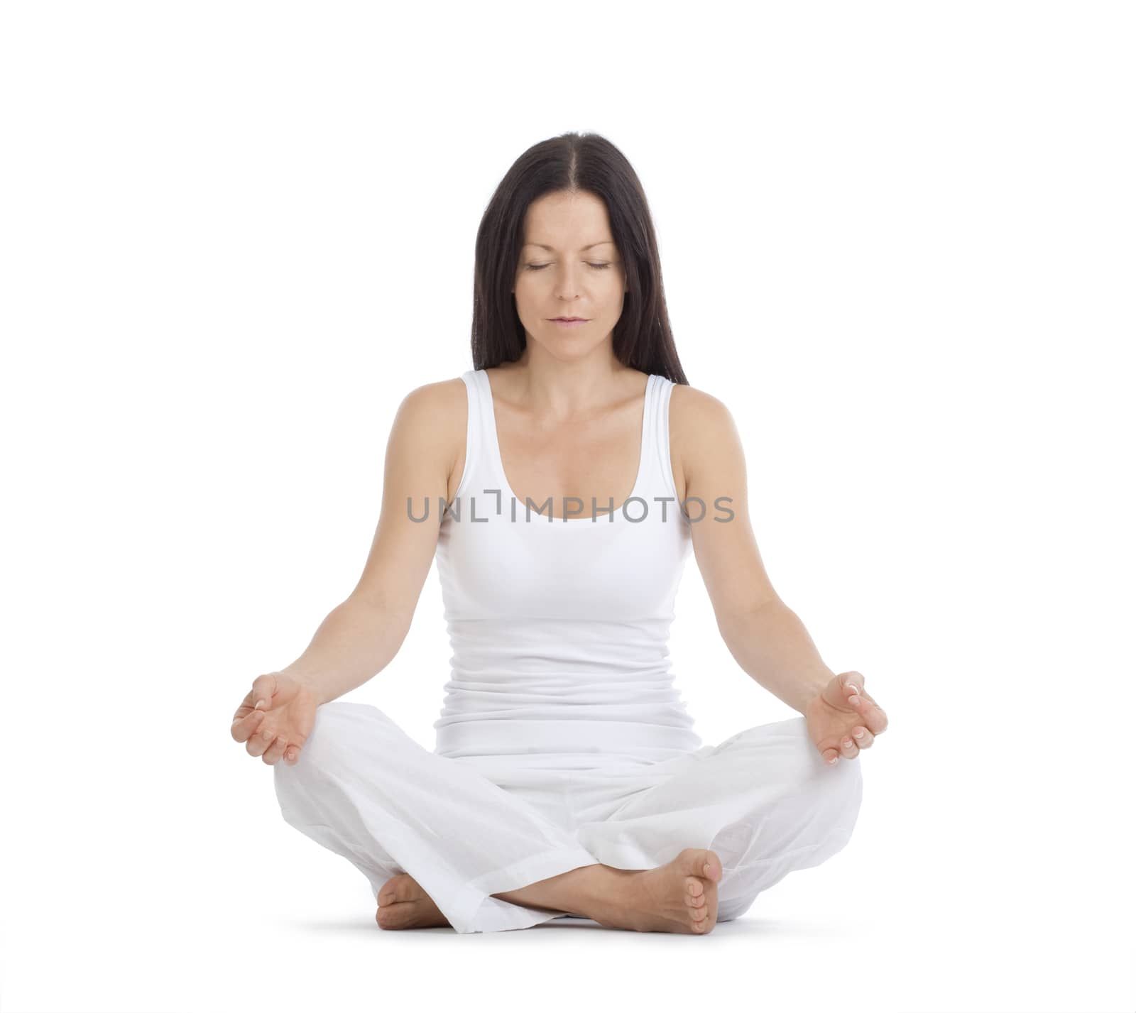 woman sitting on the floor exercising yoga - isolated on white