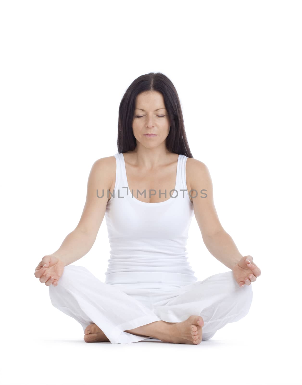 woman sitting on the floor exercising yoga - isolated on white