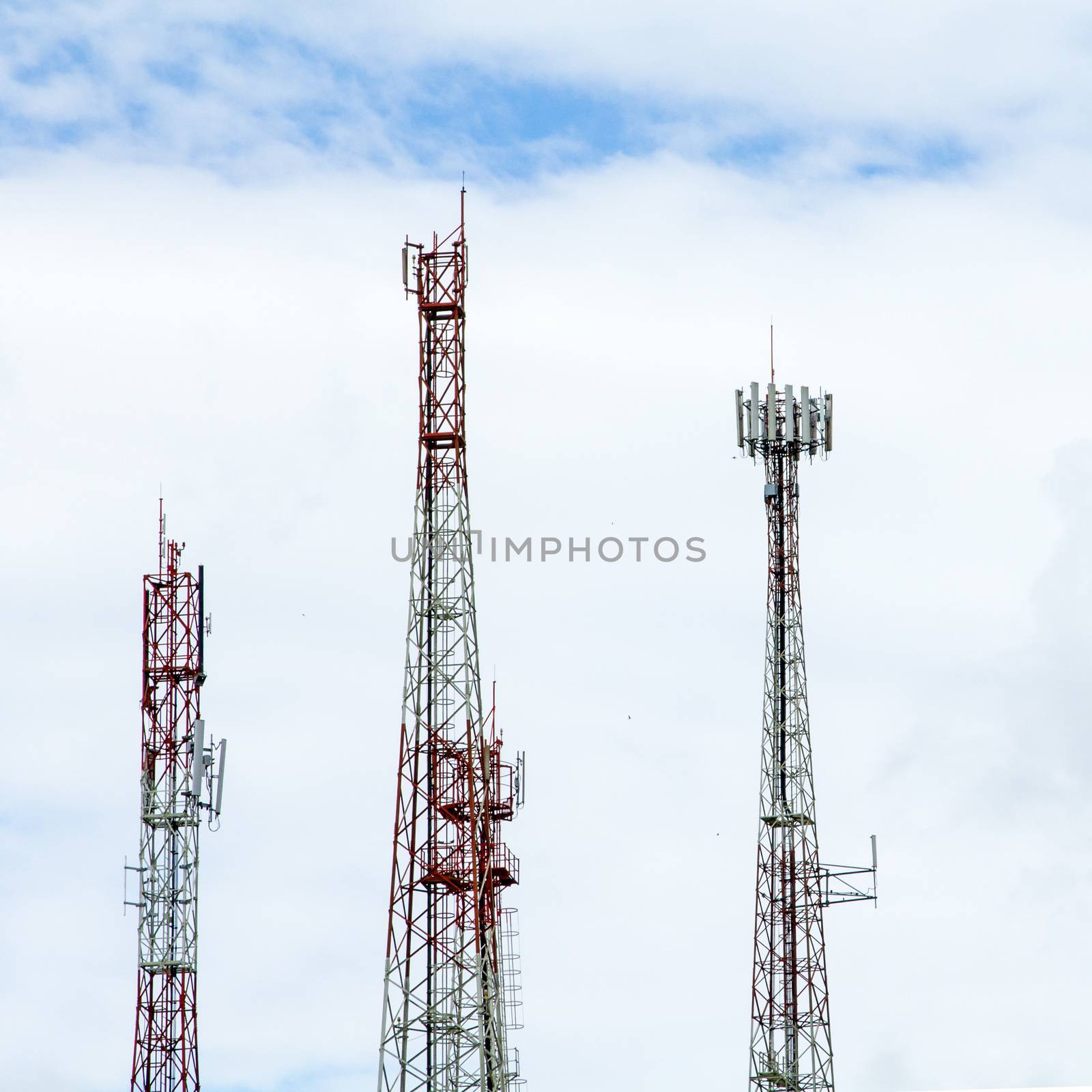 Communication tower over a blue sky background