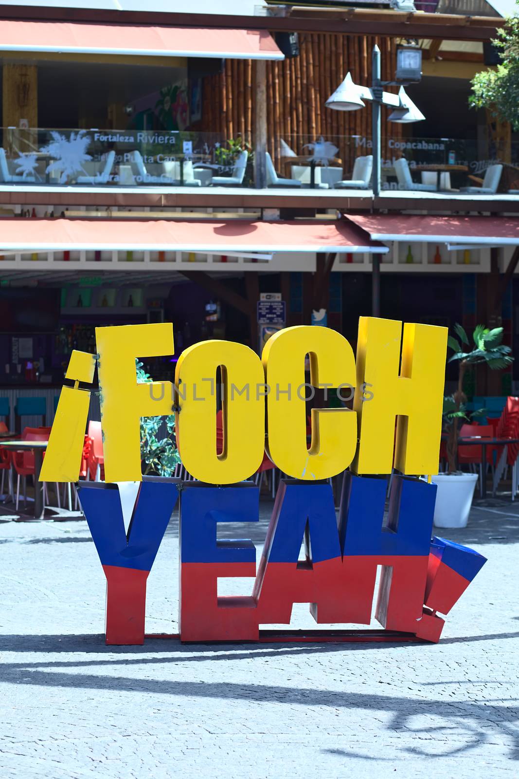 QUITO, ECUADOR - AUGUST 4, 2014: Foch Yeah sign in the Ecuadorian colors on Plaza Foch (Foch Square) at the intersection of Reina Victoria and Mariscal Foch Streets in the tourist district of La Mariscal on August 4, 2014 in Quito, Ecuador. On and around this square many restaurants, bars, cafes and hostels are located.