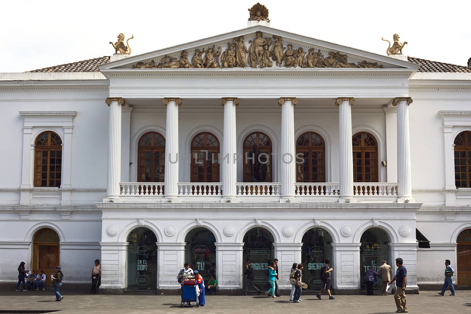 QUITO, ECUADOR - AUGUST 4, 2014: Unidentified people walking in front of the Teatro Nacional Sucre (Sucre National Theater) on Plaza del Teatro in the historic city center on August 4, 2014 in Quito, Ecuador. Quito is an UNESCO World Cultural Heritage Site. 