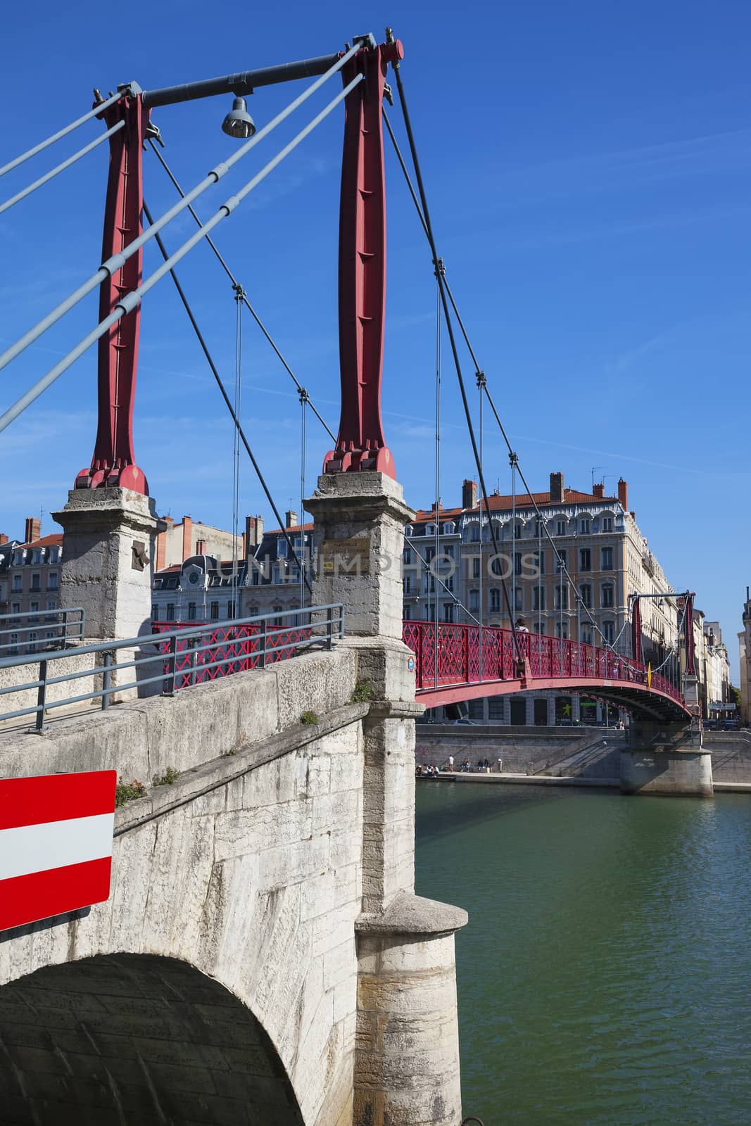View of Lyon city with red footbridge