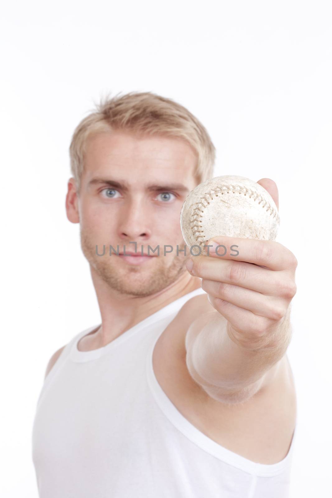 man holding out a baseball in his hand - short depth of field - isolated on white