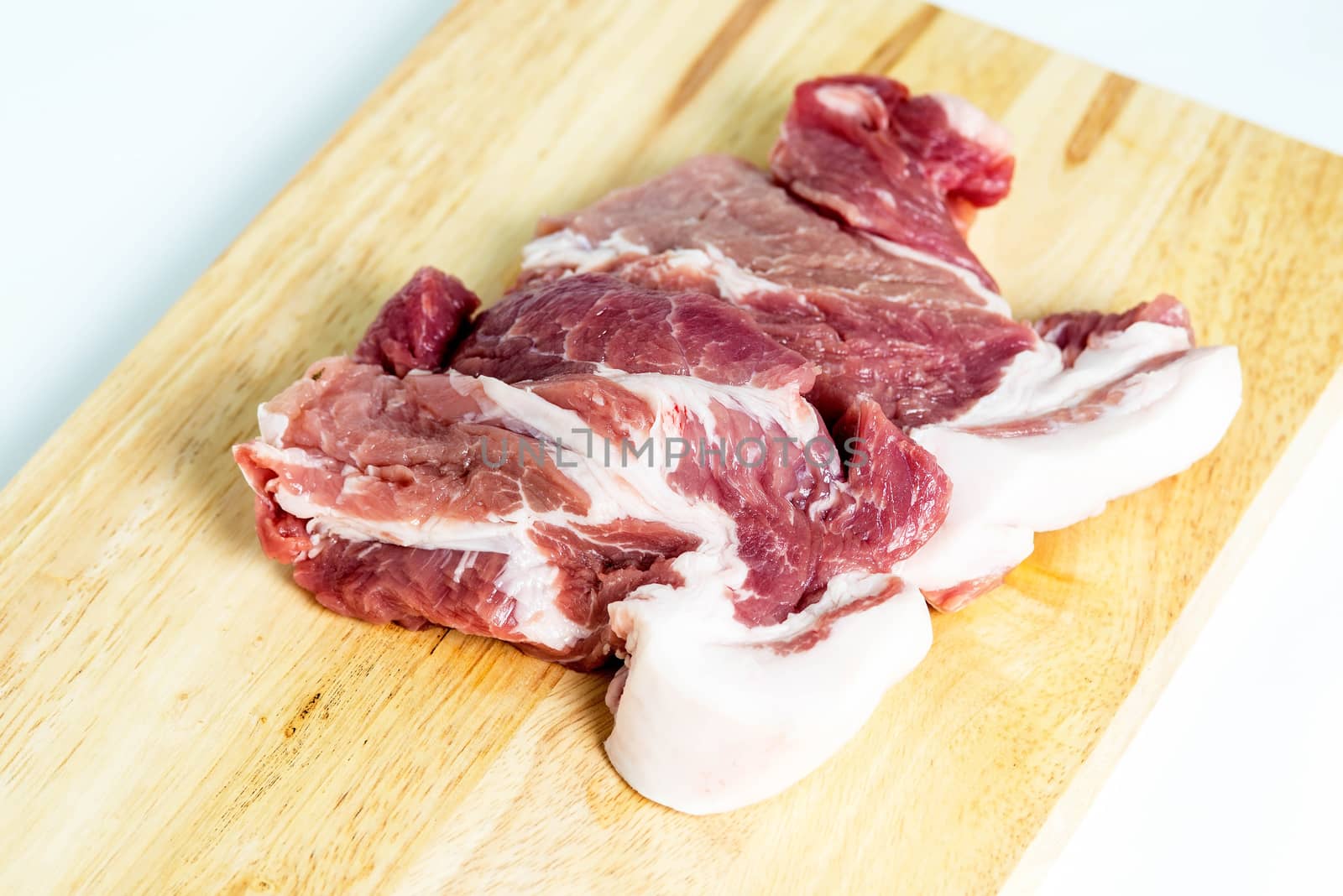 Fresh pork meat on a cutting board by Yuri2012