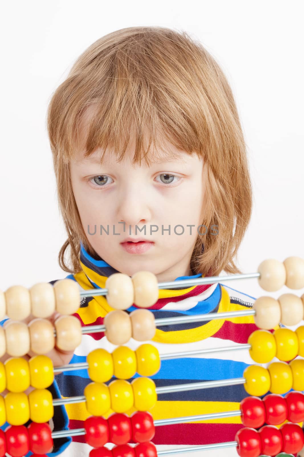 Child Counting on Colorful Wooden Abacus by courtyardpix