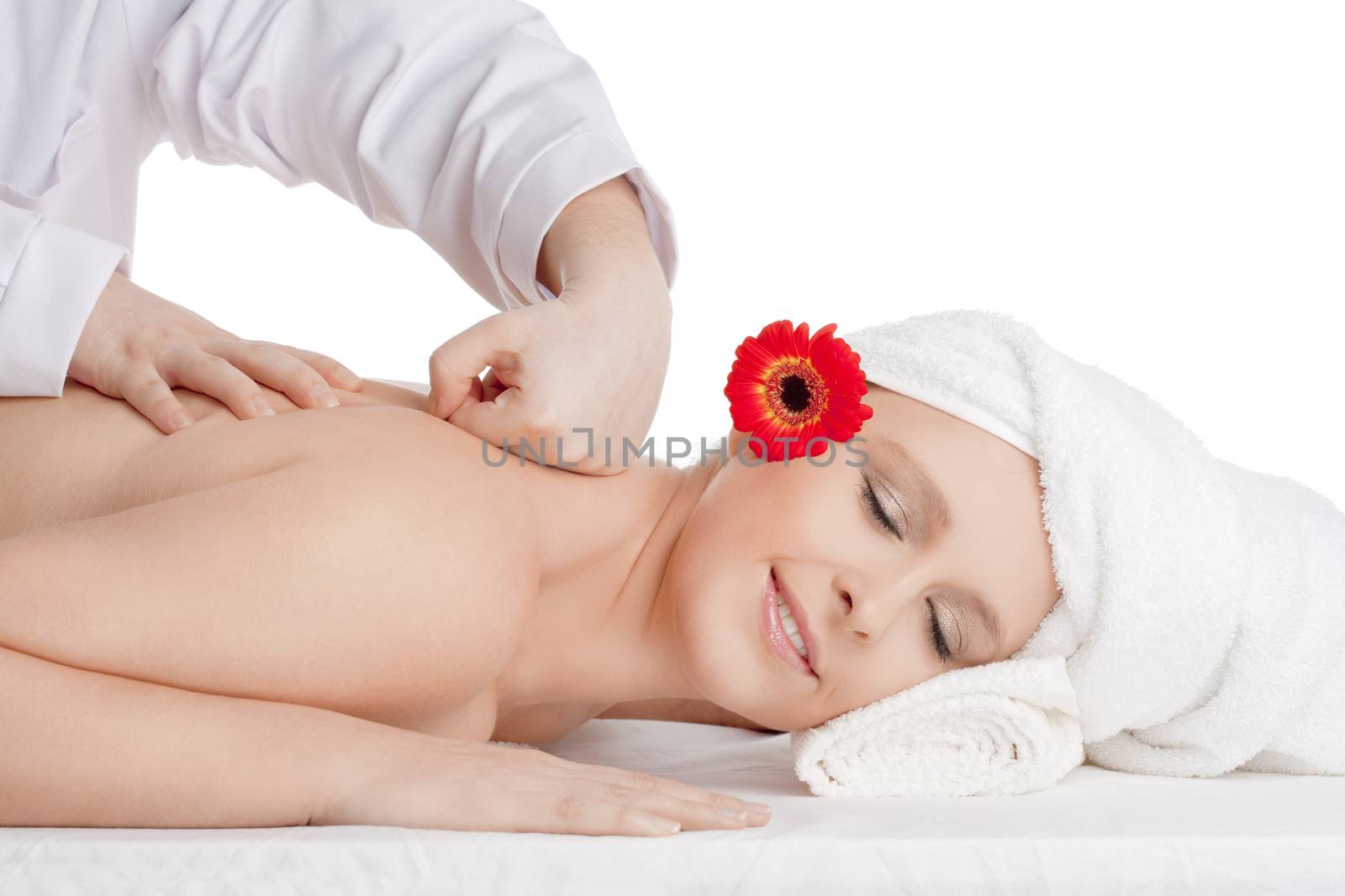 Beautiful Woman Enjoying Back Massage at Beauty Spa by courtyardpix