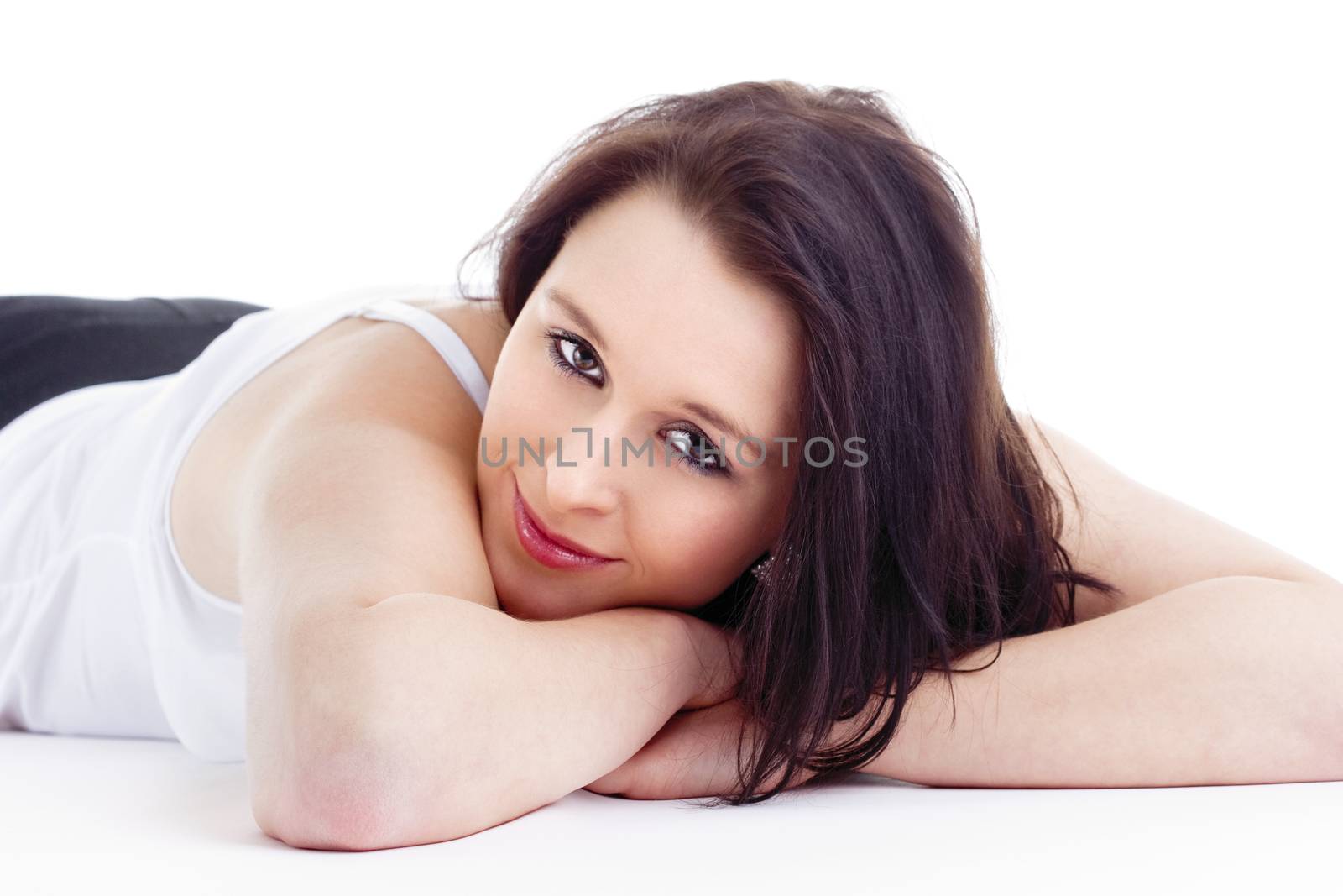 Portrait of Young Woman Lying on the Floor Looking - Isolated on White