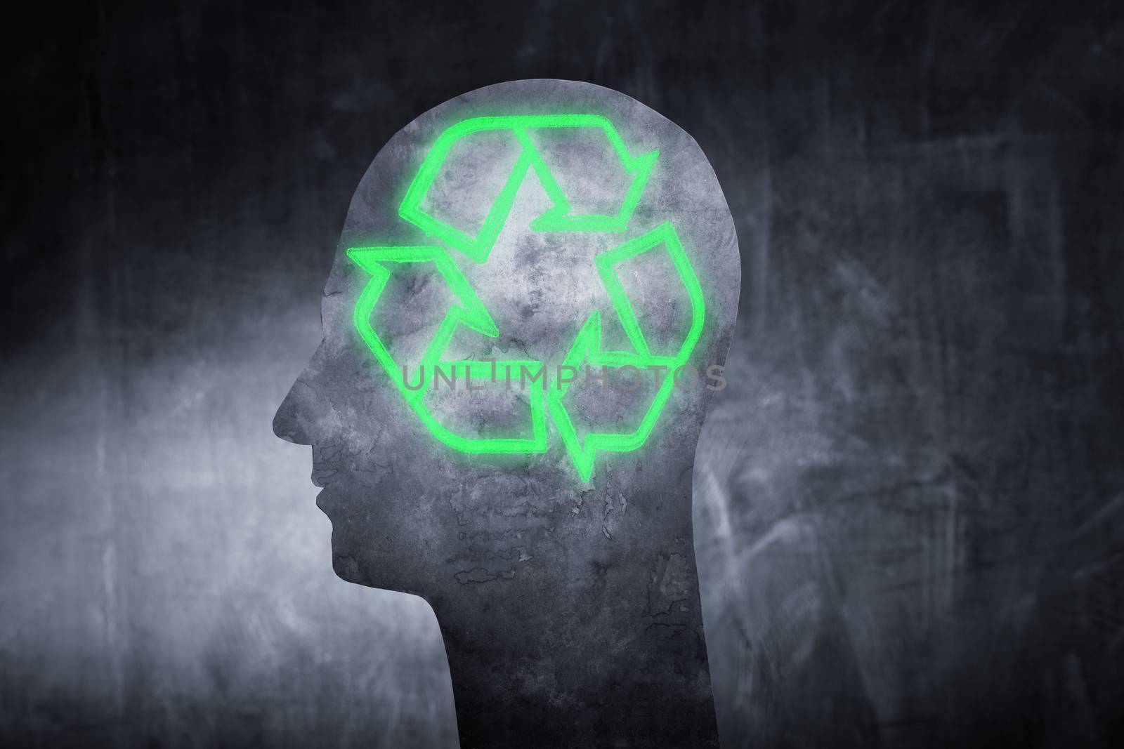 Conceptual image of a human head with a glowing universal recycling symbol.