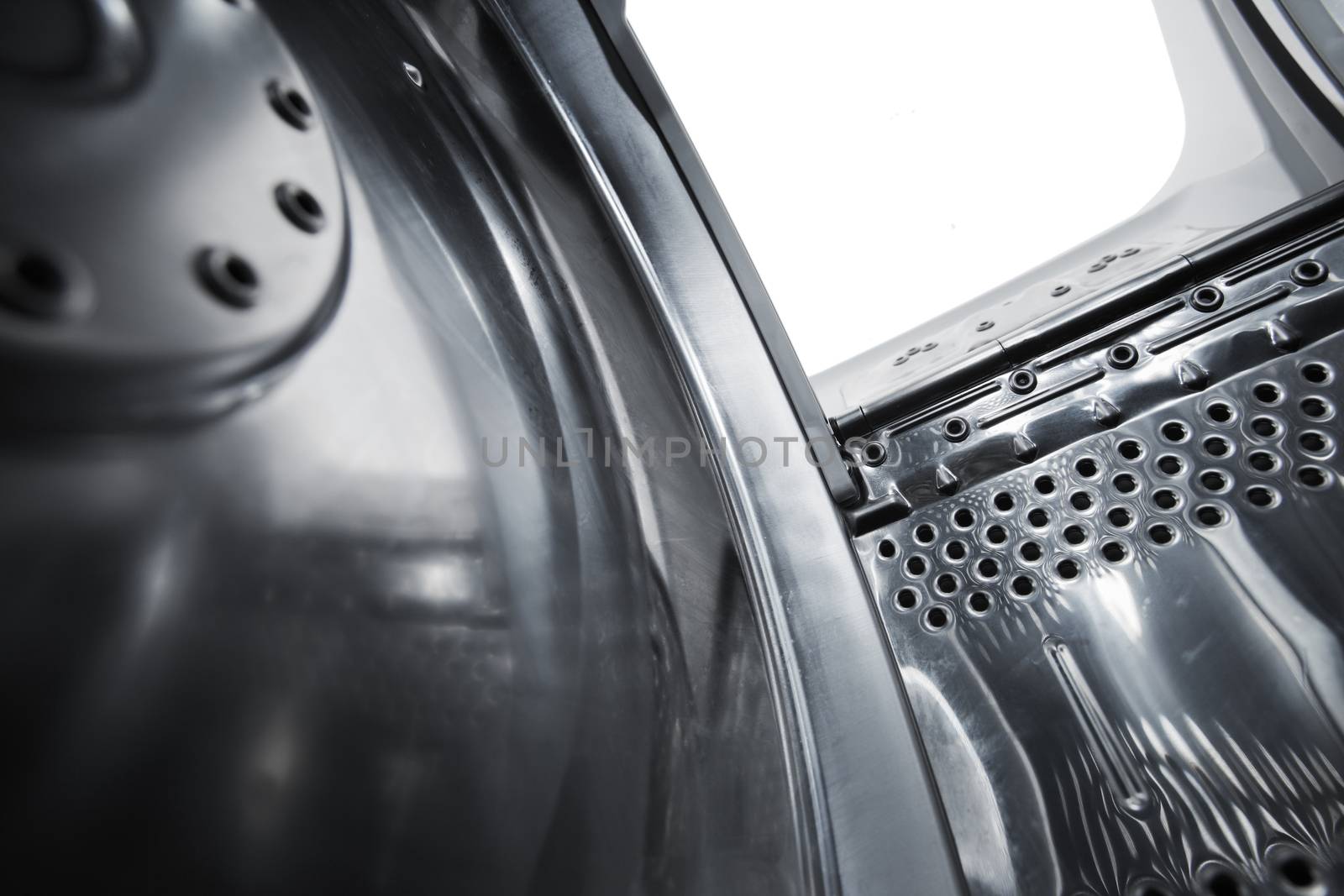 Interior view of a new european top loading washing machine. Very short depth-of-field.