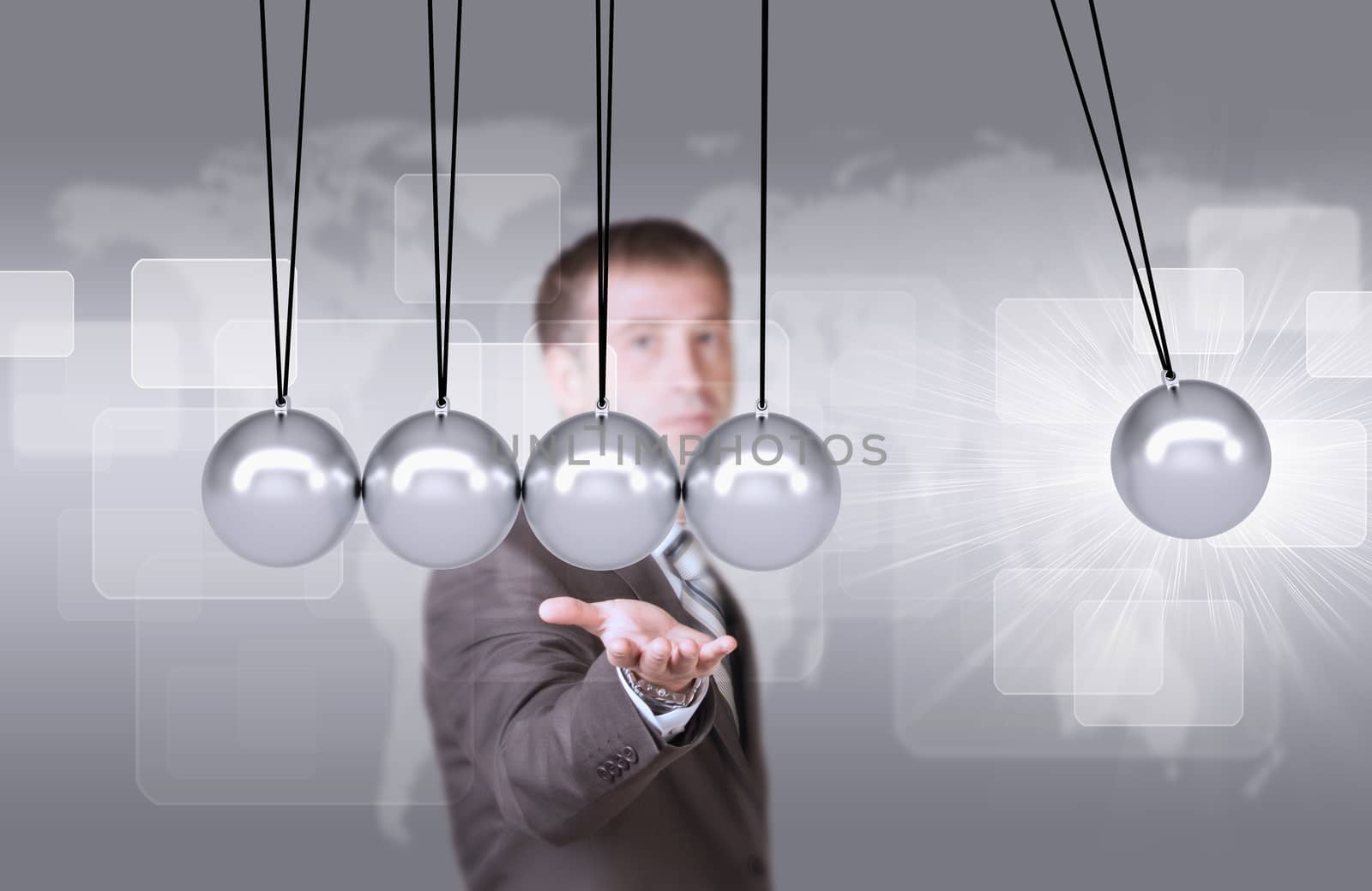 Businessman in suit hold Newtons cradle. World map and rectangles as backdrop