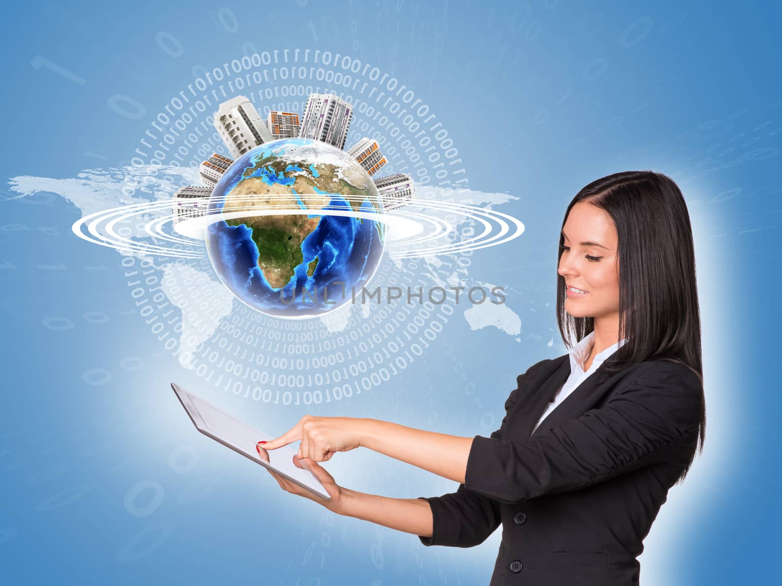 Beautiful businesswoman in suit using tablet. Earth with buildings and world map. Element of this image furnished by NASA