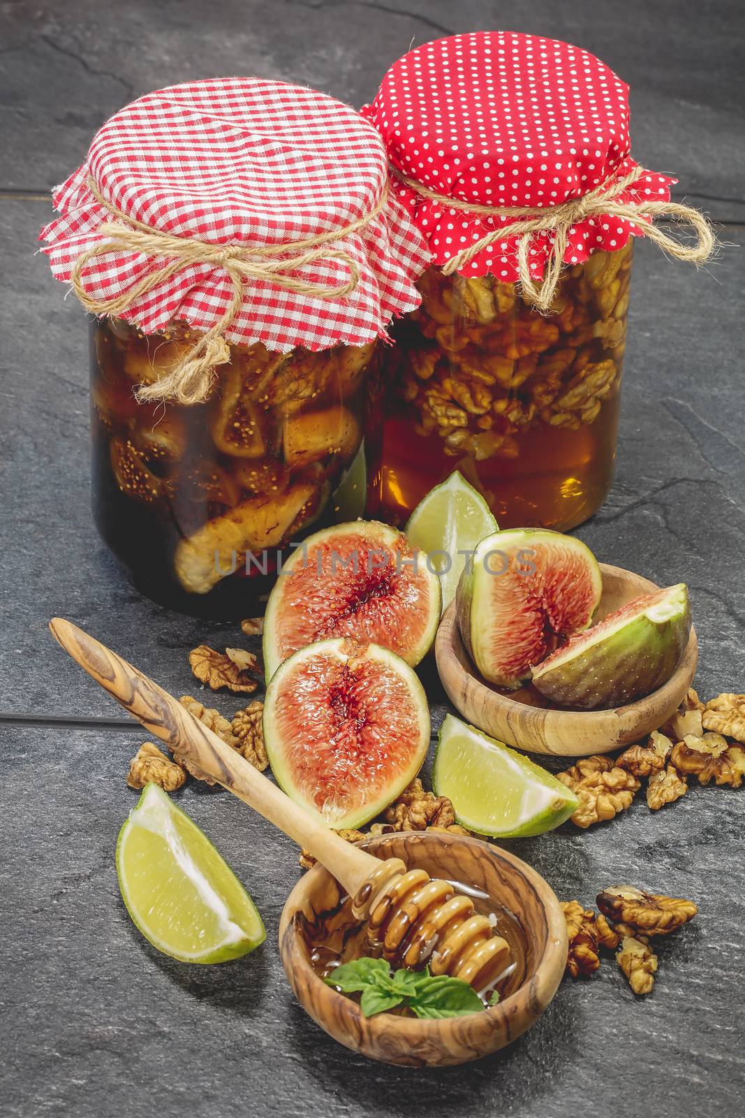 Honey with nuts and dried fruit in jar by Slast20