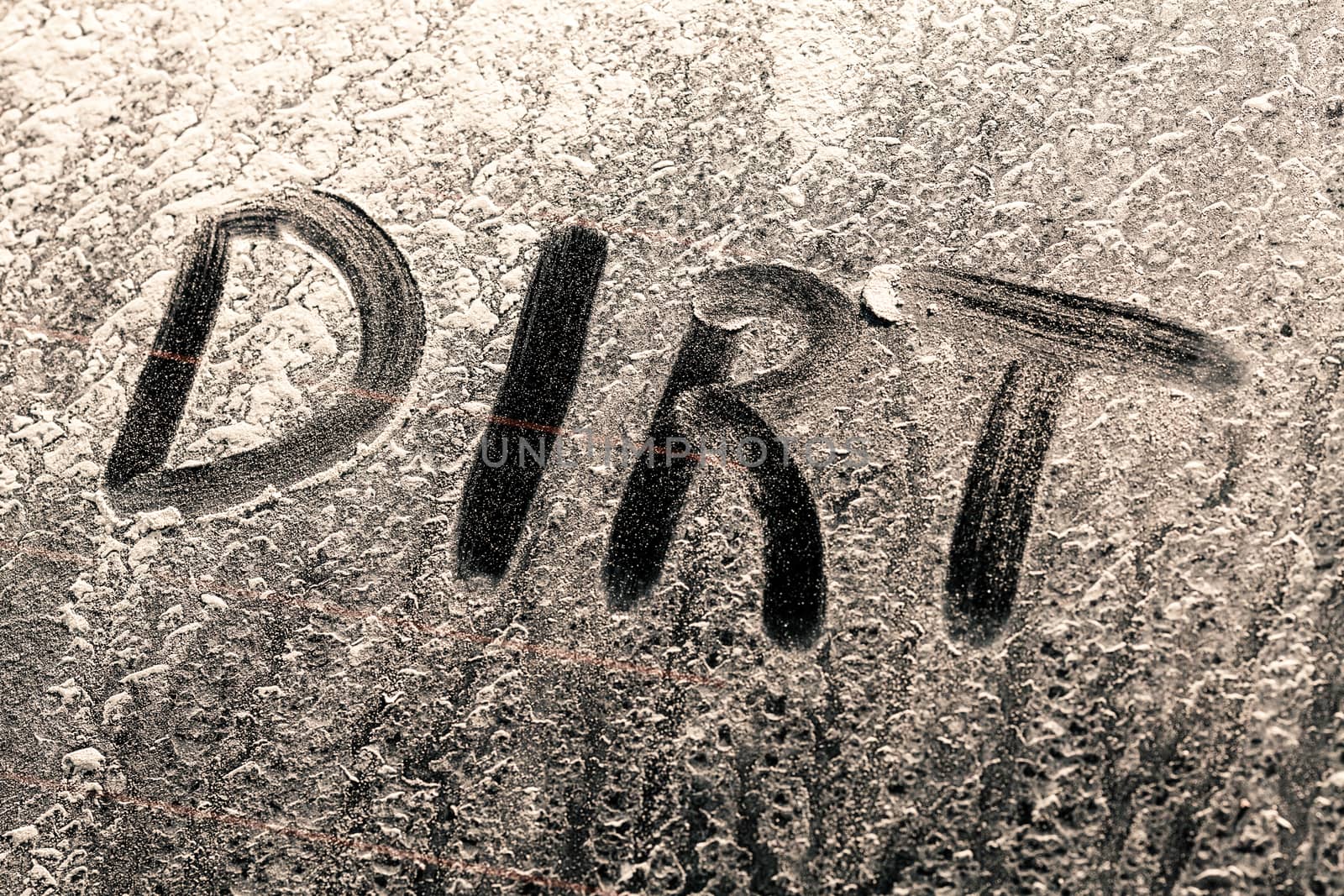 Dirt Word on a Dirty Car Window