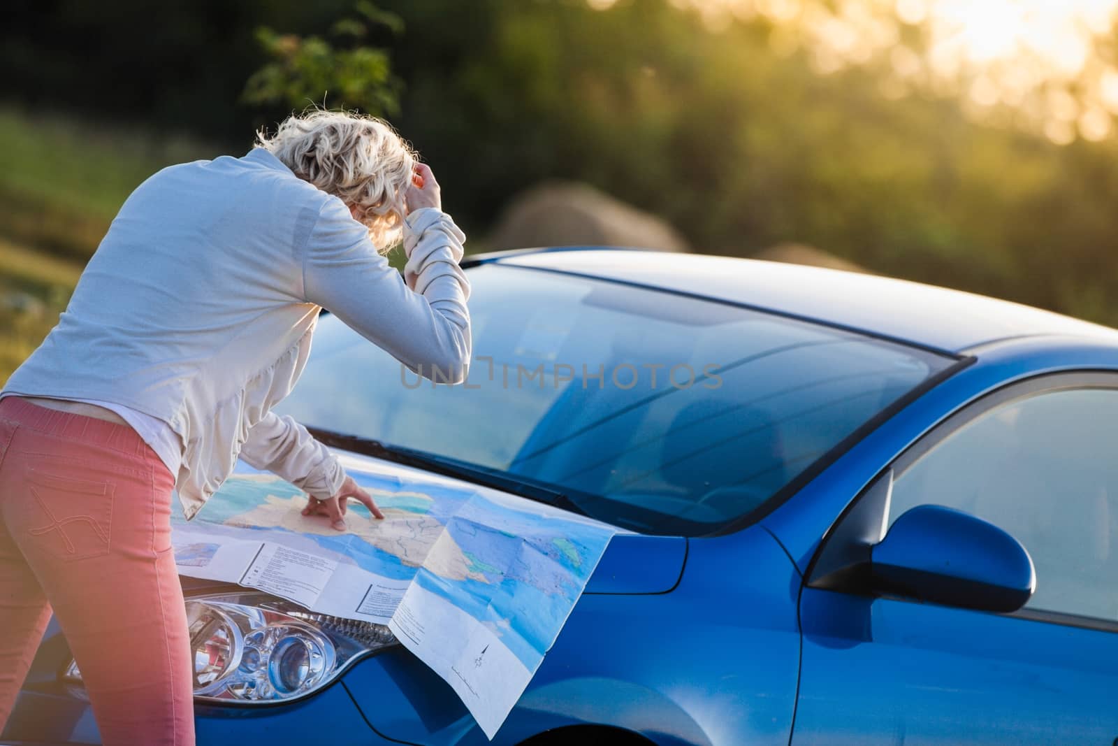 Lost Woman on a Rural Scene Looking at a Map