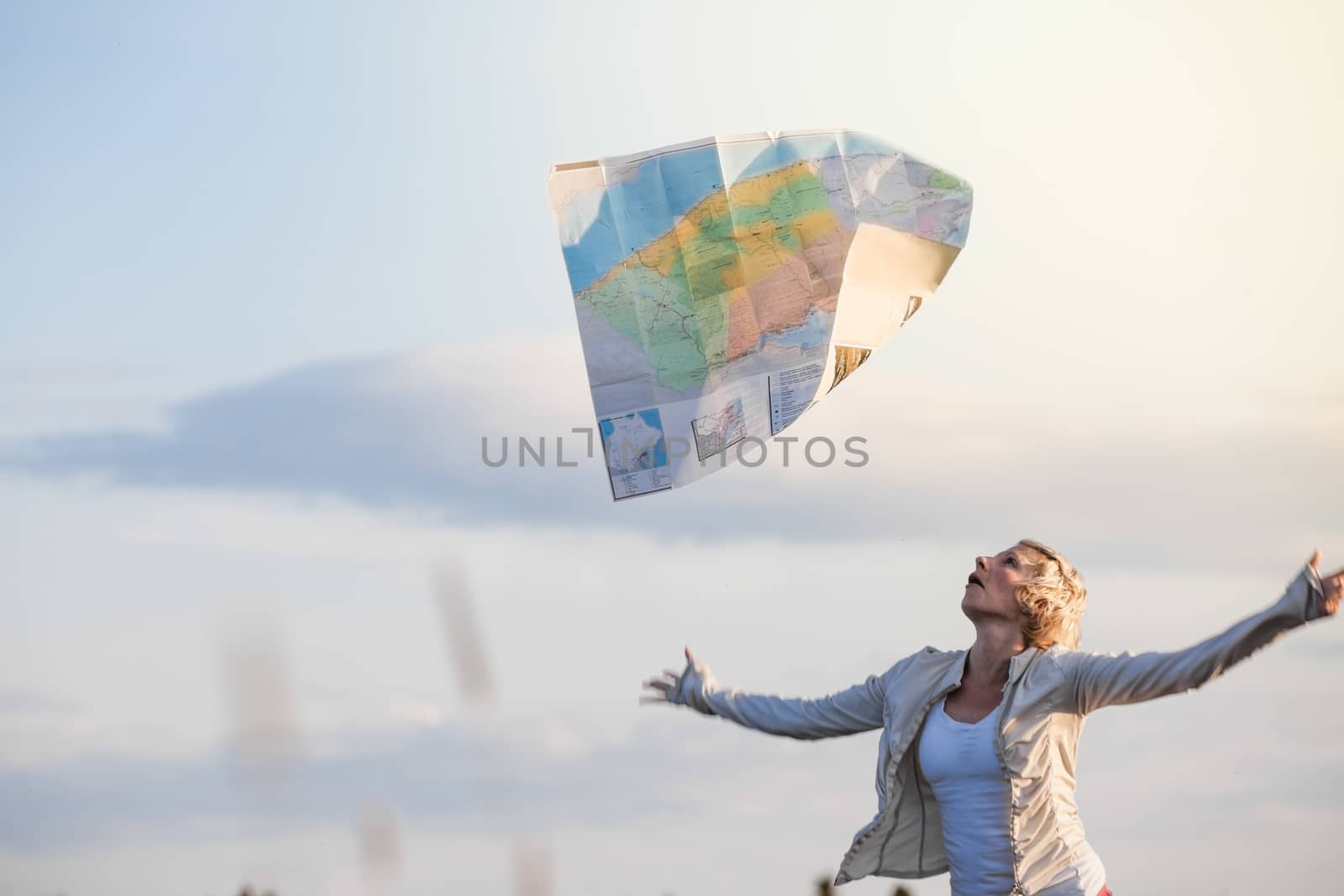 Young Lost Woman Losing a Map Because of the Wind by aetb