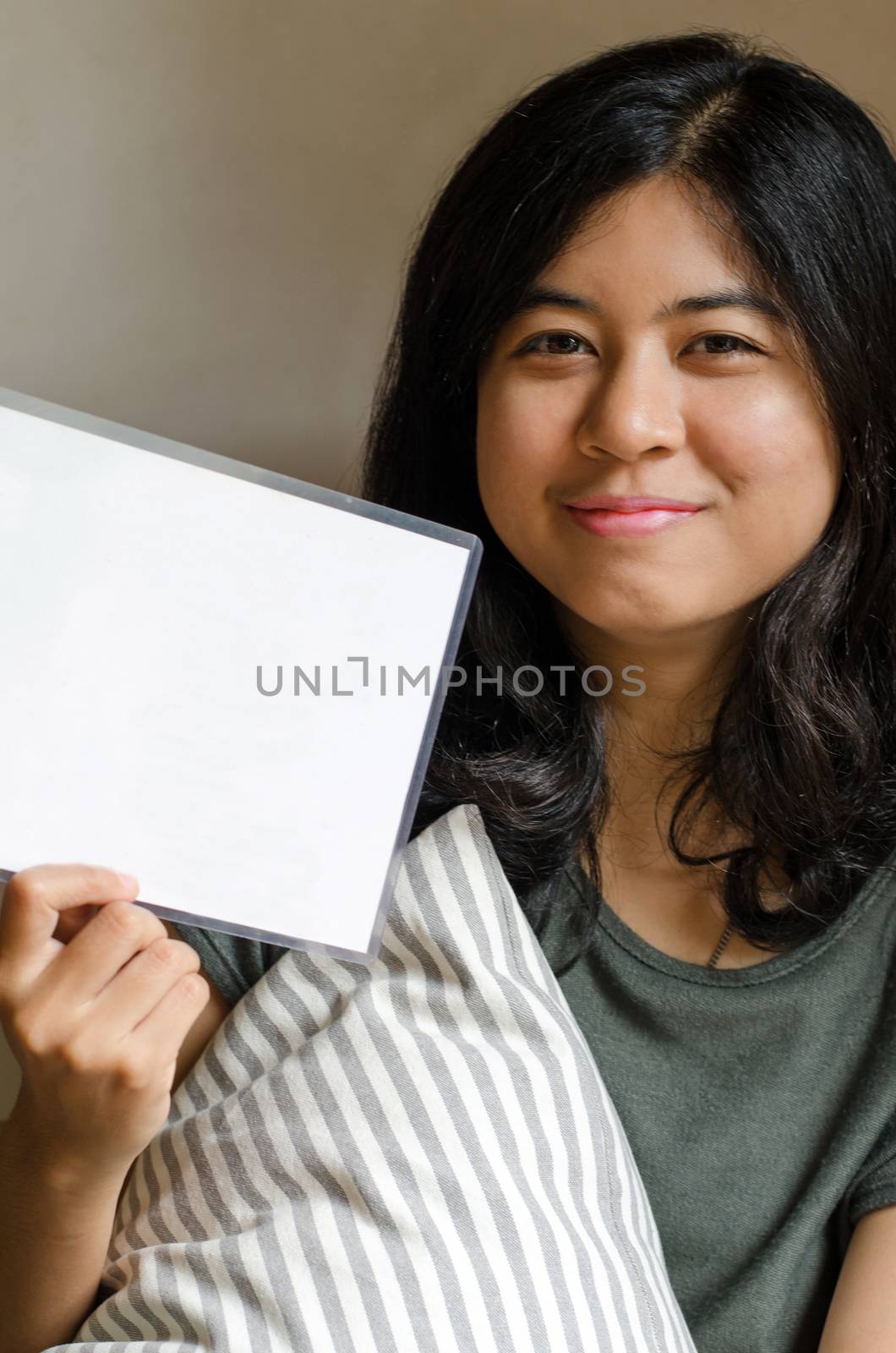 Happy asian woman hold white blank board