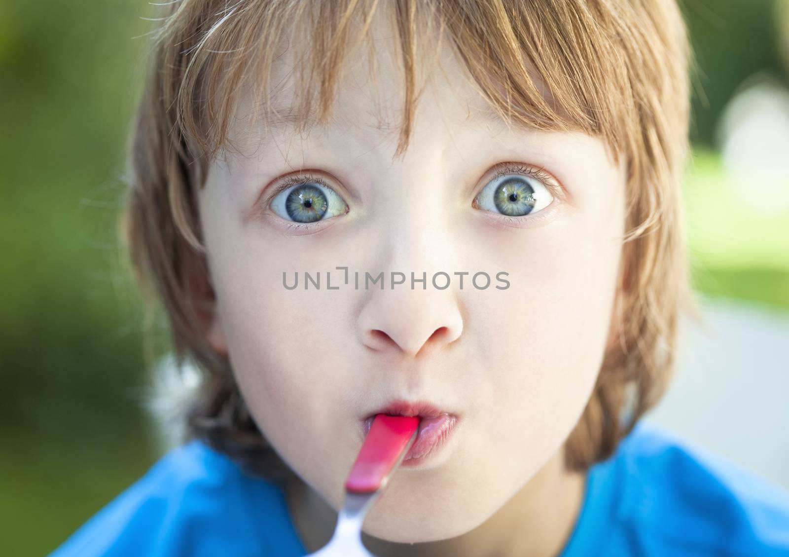 Boy Eating Outdoors by courtyardpix