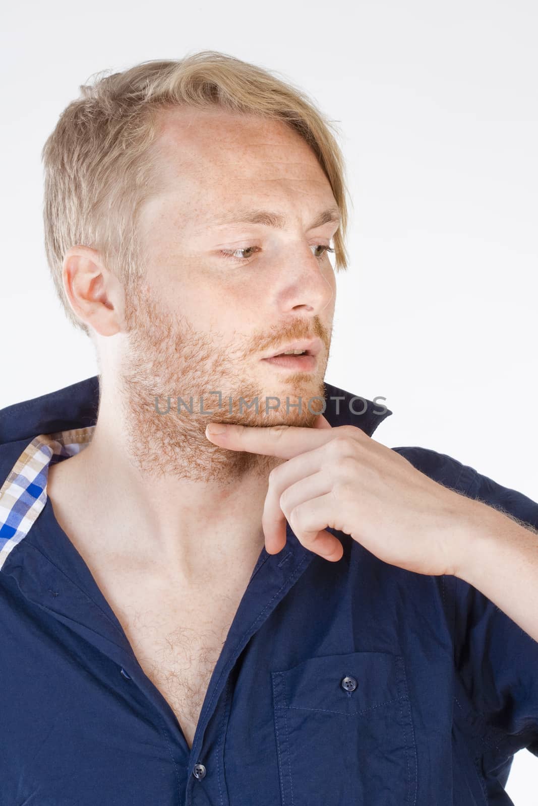 Young Man with Blond Hair Thinking