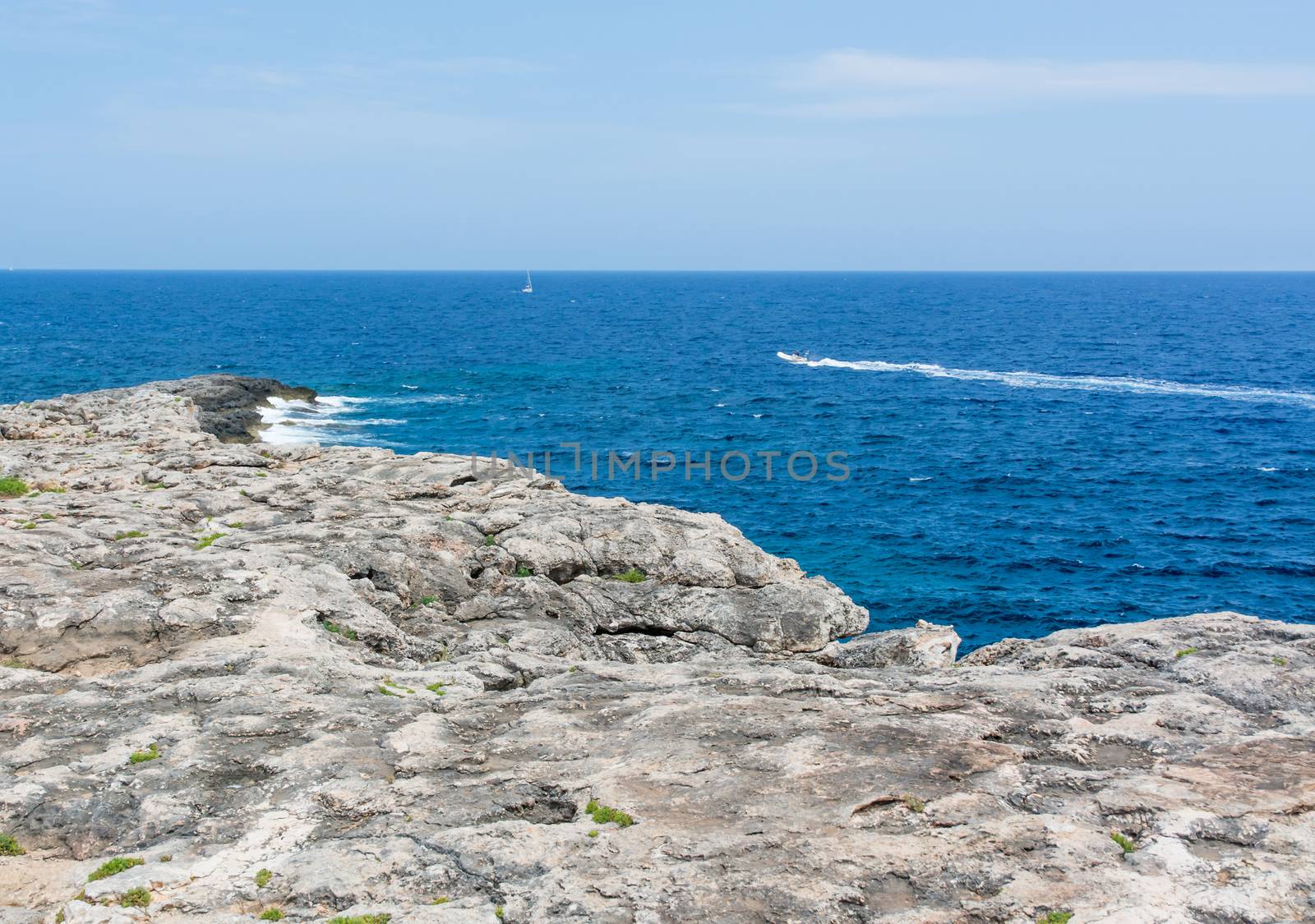Rock form and ultramarine ocean. Mallorca, Balearic islands, Spain in July.