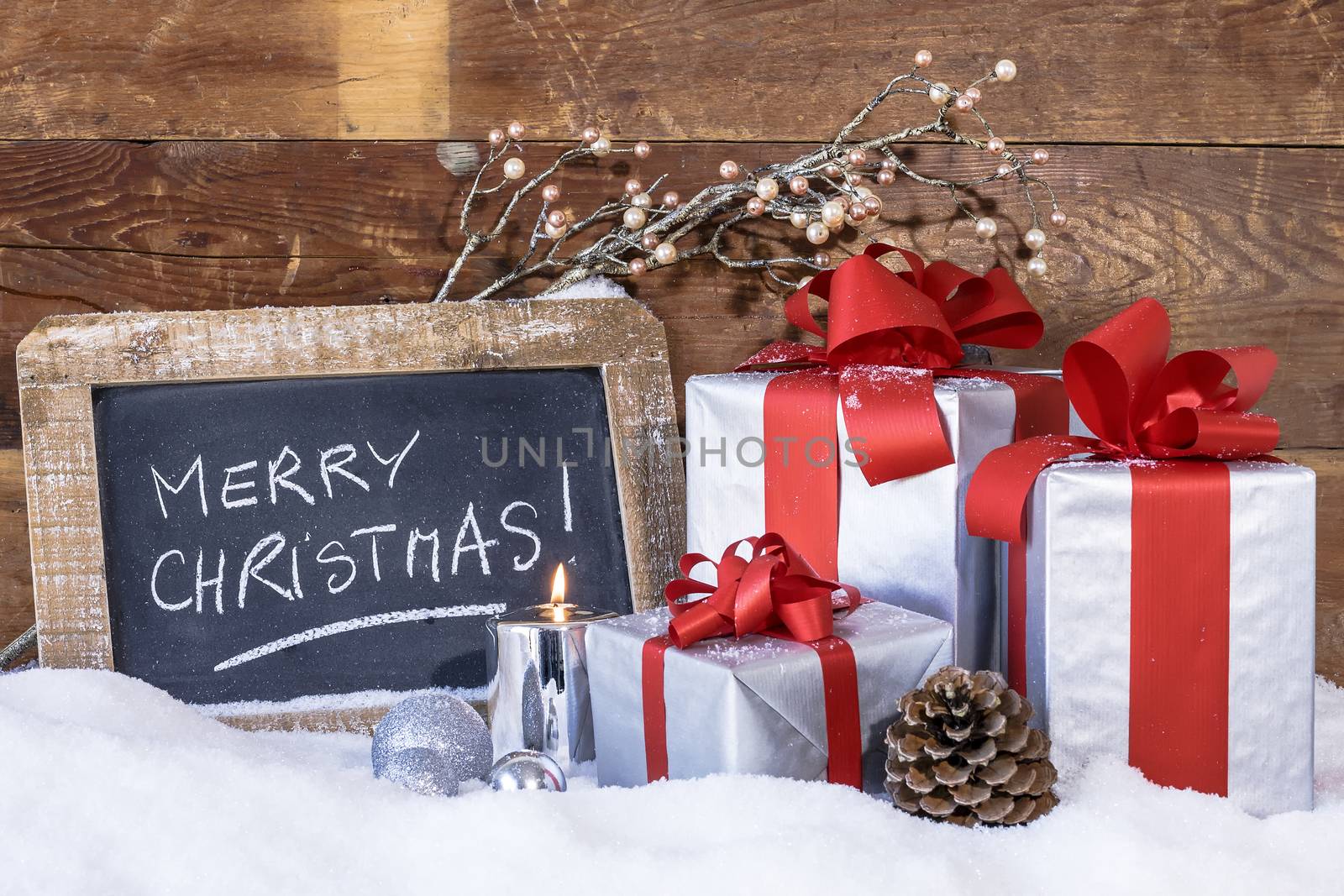 View of Christmas gifts with candles.