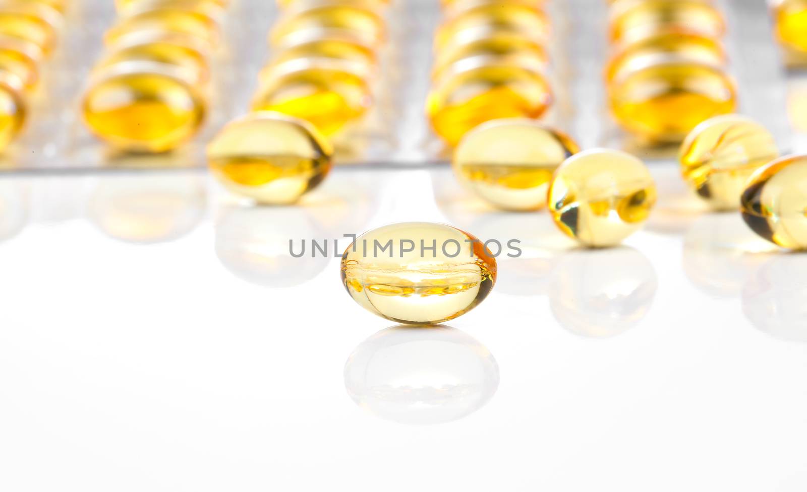 fish oil capsules and blister pack isolated on white background