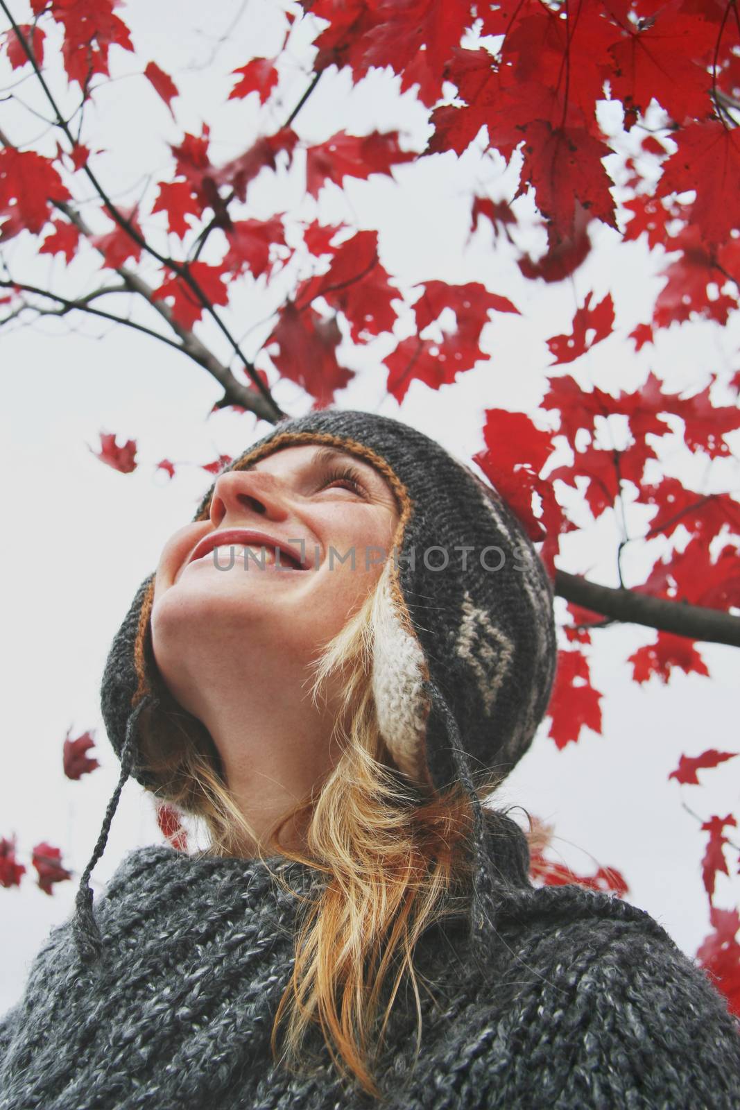 Young woman looking at the autumn sky