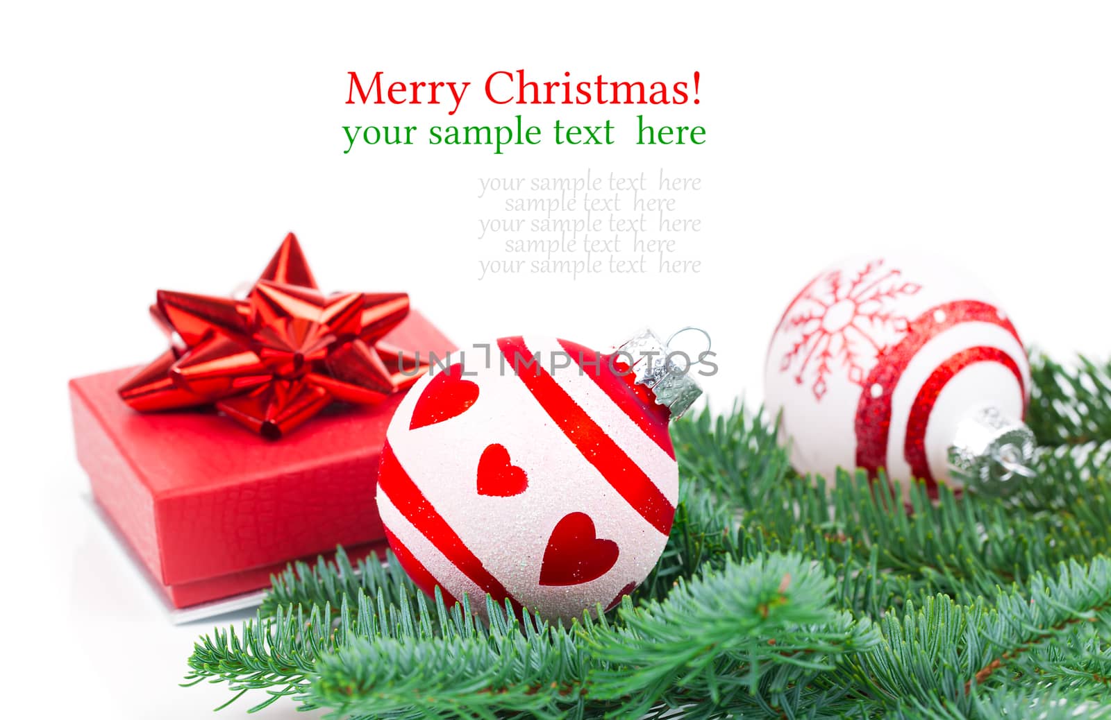 Christmas balls and fir branches with decorations isolated over white