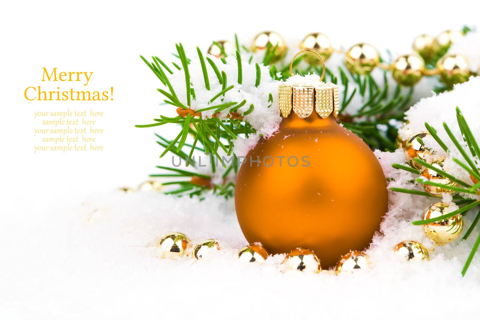 orange xmas baubles on white snow
