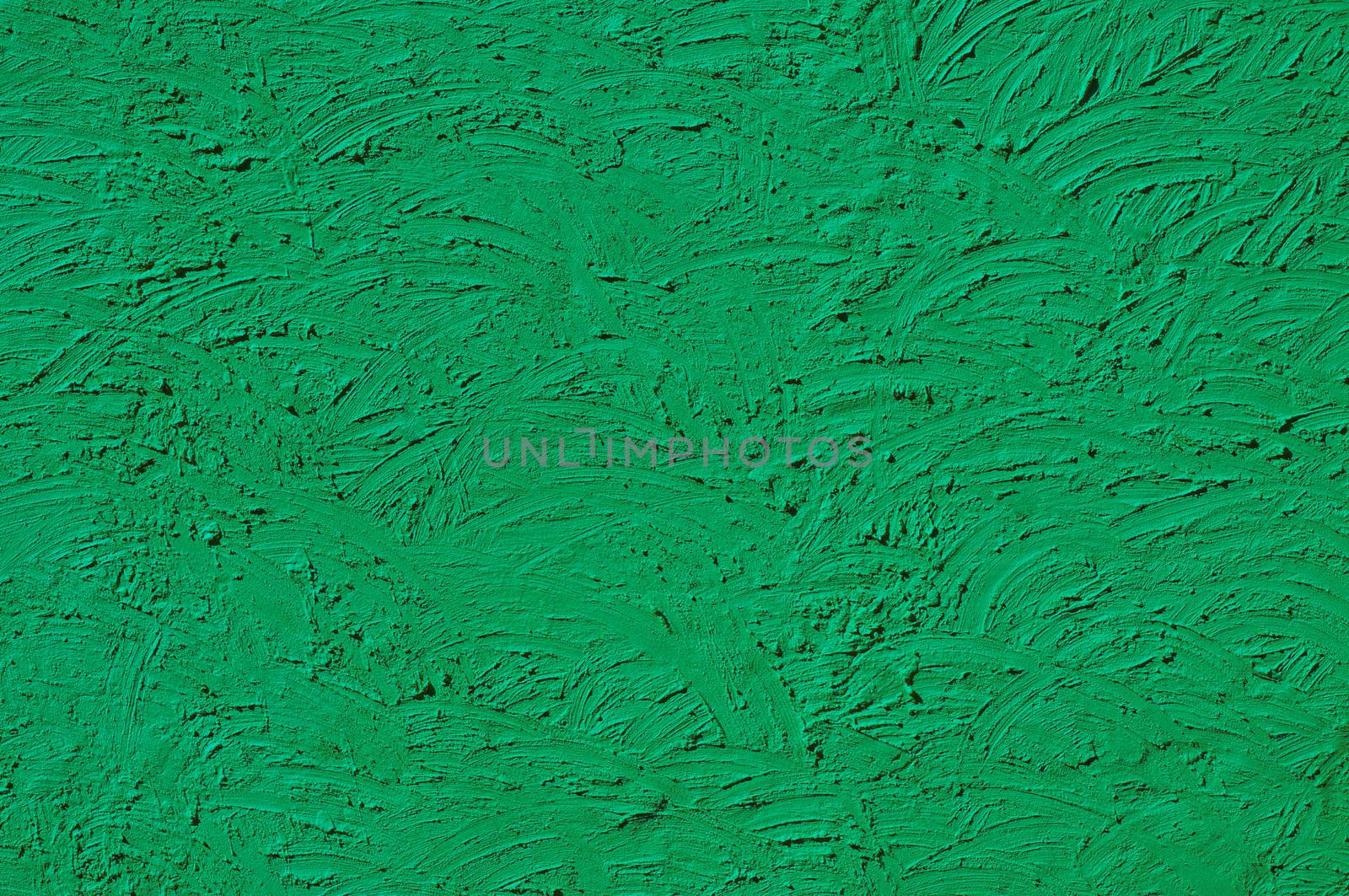 The texture of green walls painted large erratic strokes of paint                                  