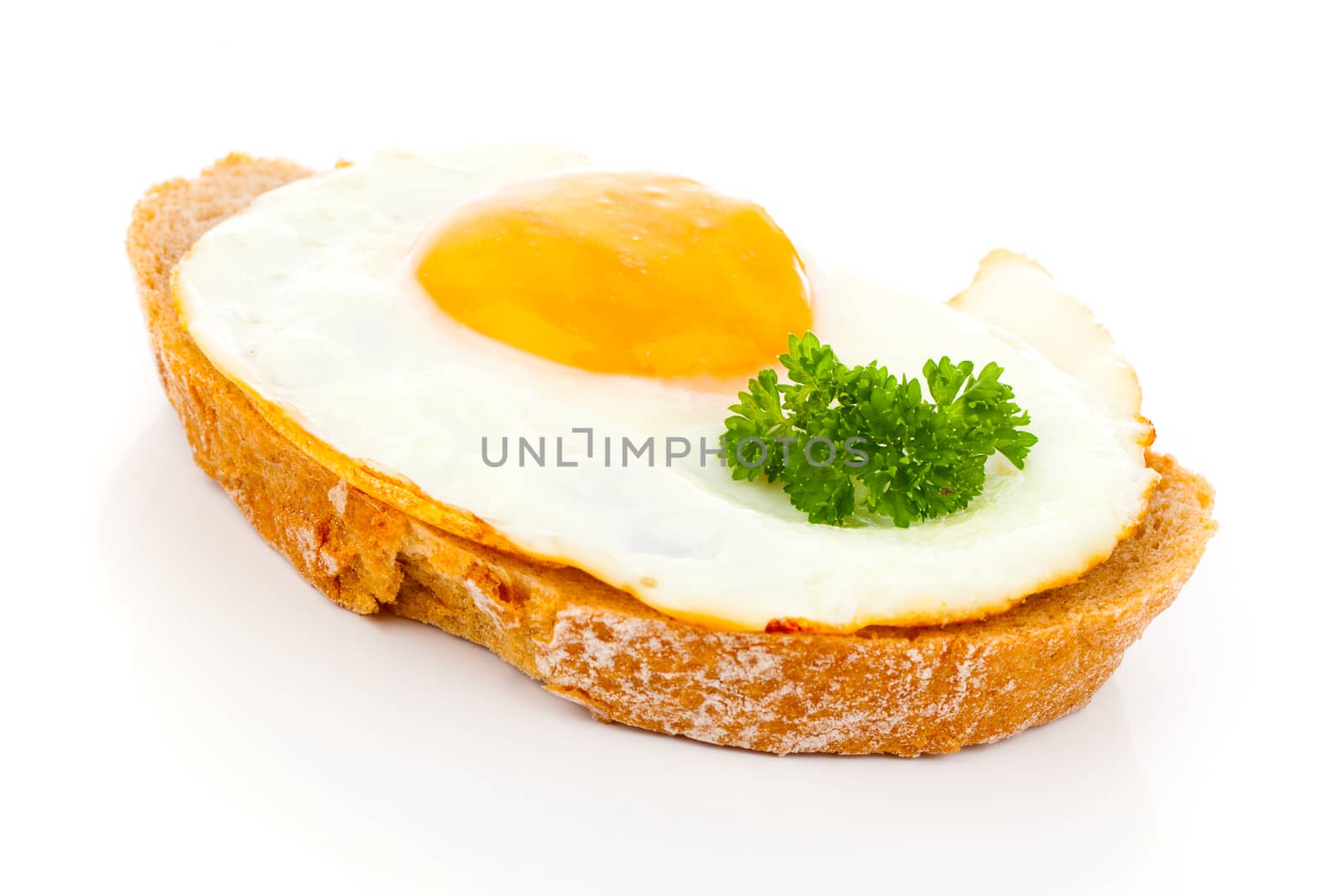 Fried eggs on crusty toasted bread