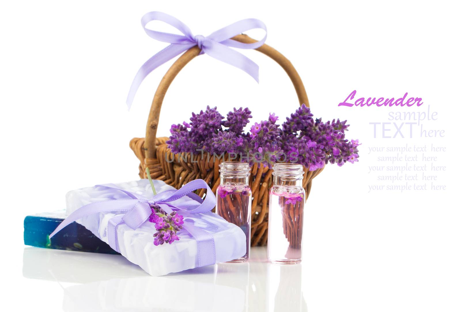 Natural handmade lavender soap and oil with fresh lavender on white background