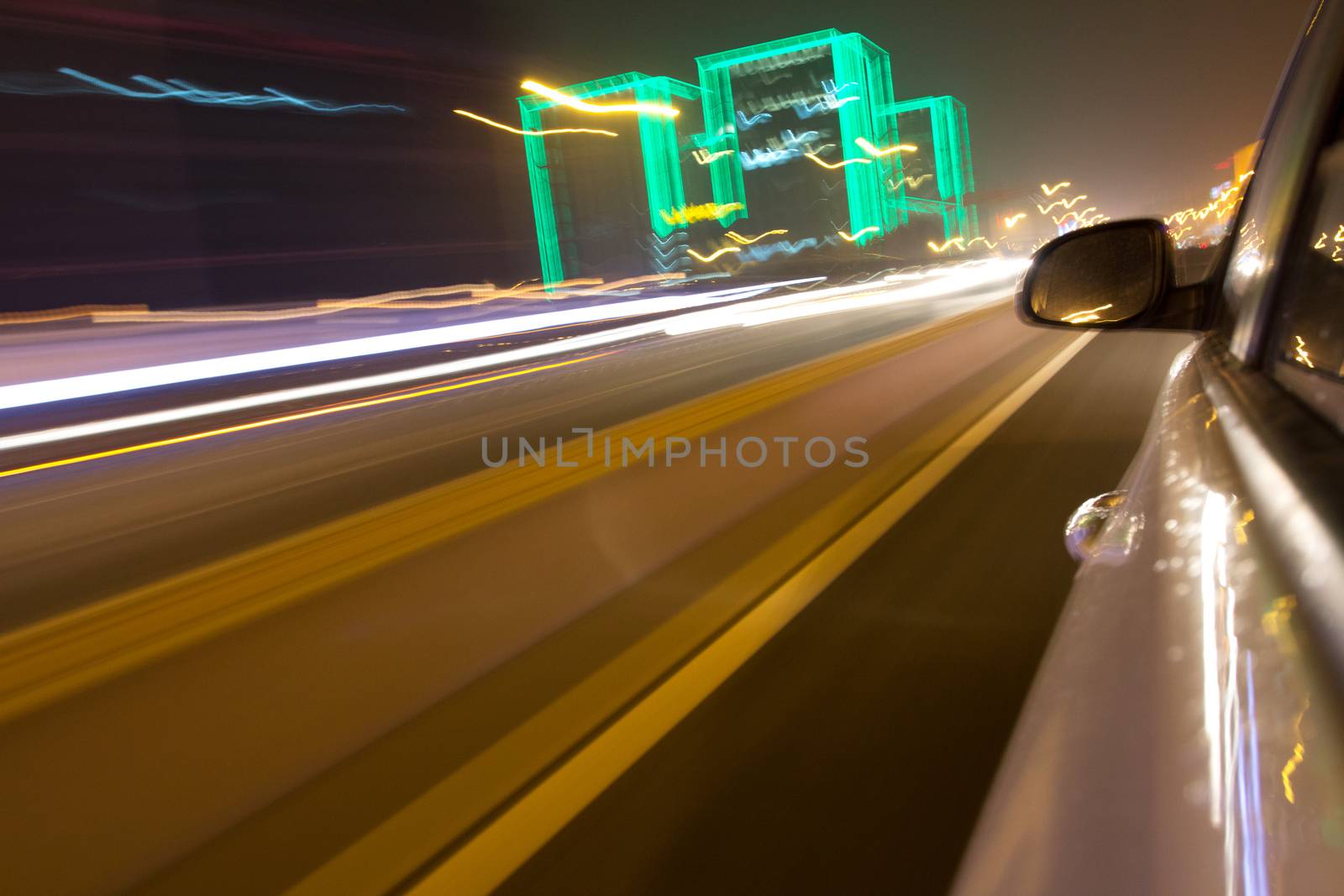 driving car in the night, view from side of car,blurred motion