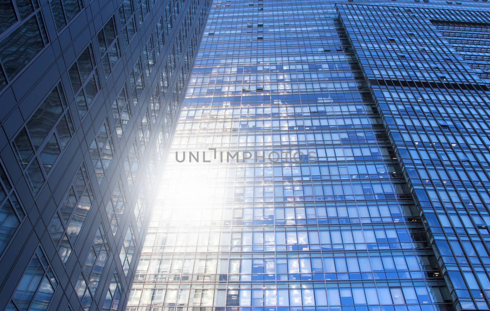glass wall of office building,with reflection of clouds