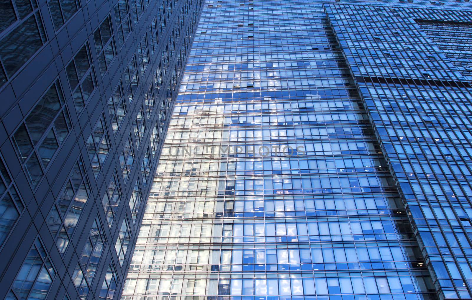 glass wall of office building,with reflection of clouds