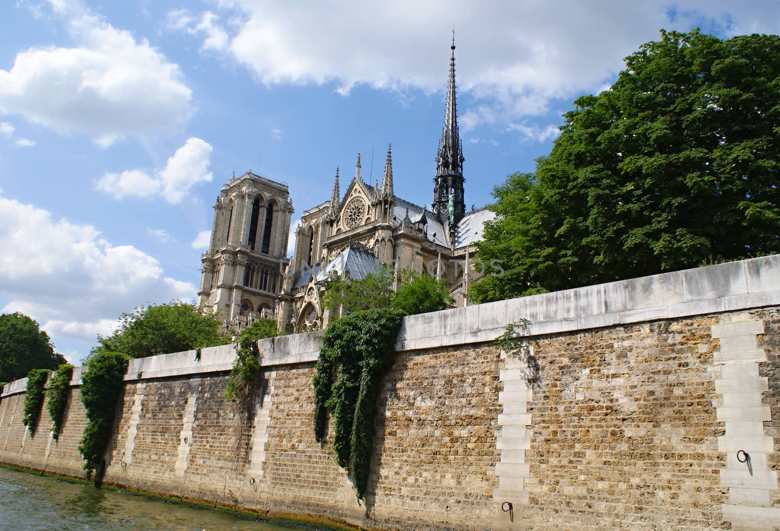 Photo is showing various views onto Paris, France with its many houses and roofs.