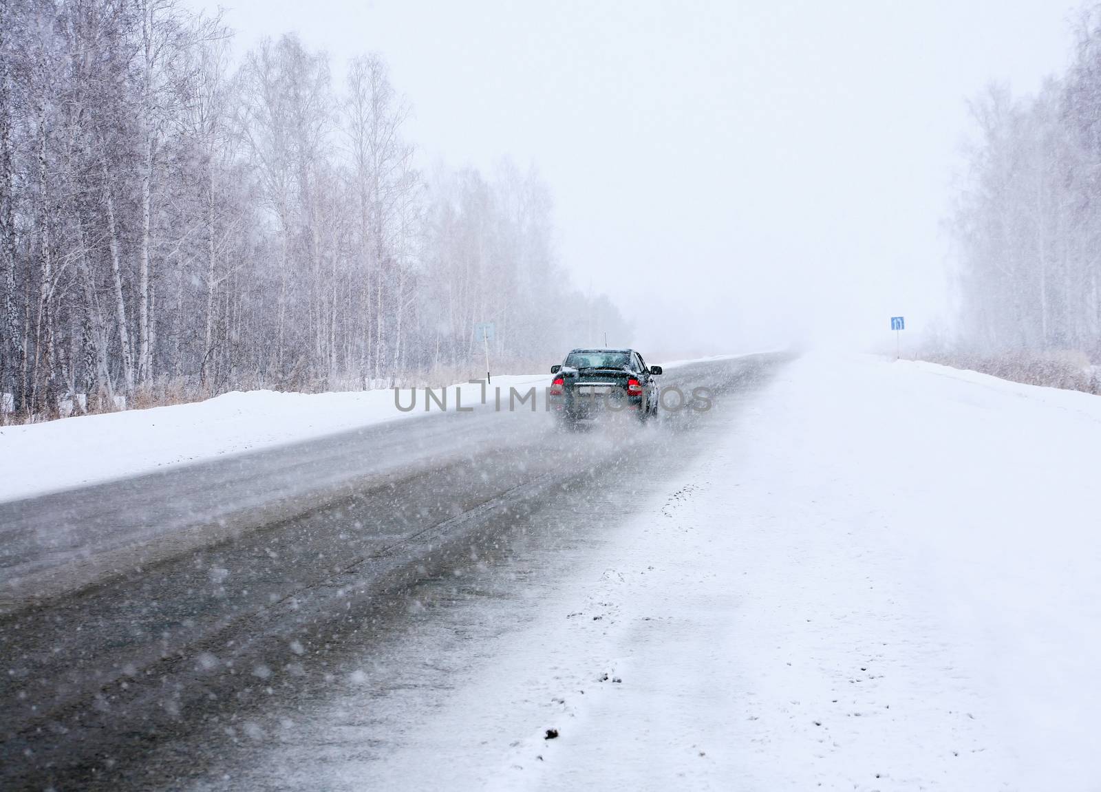 car in winter on way by yurii_bizgaimer