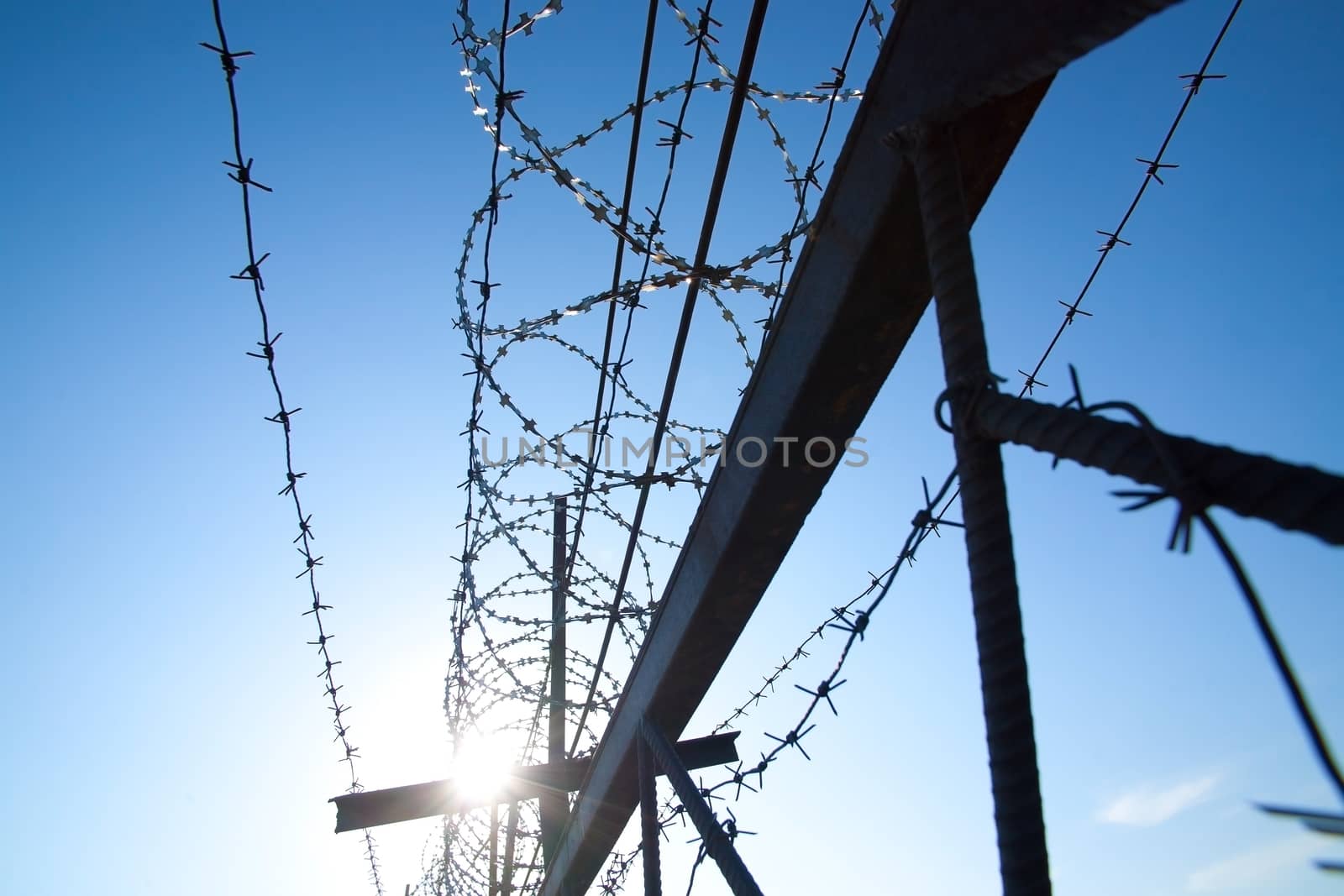 Metal barbed wire against  sky