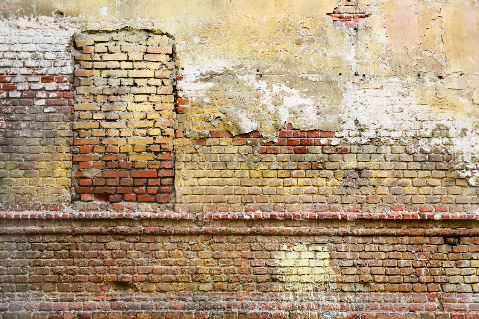 Old brick wall with the closed window