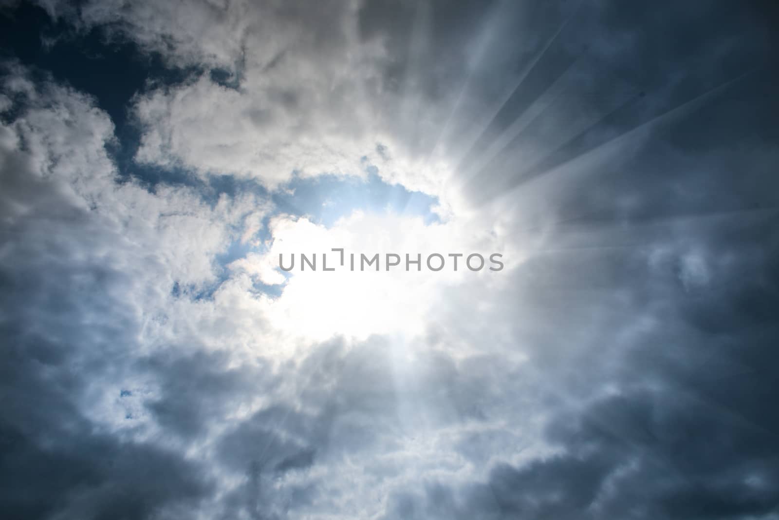 Beautiful heavenly landscape with clouds and the sun