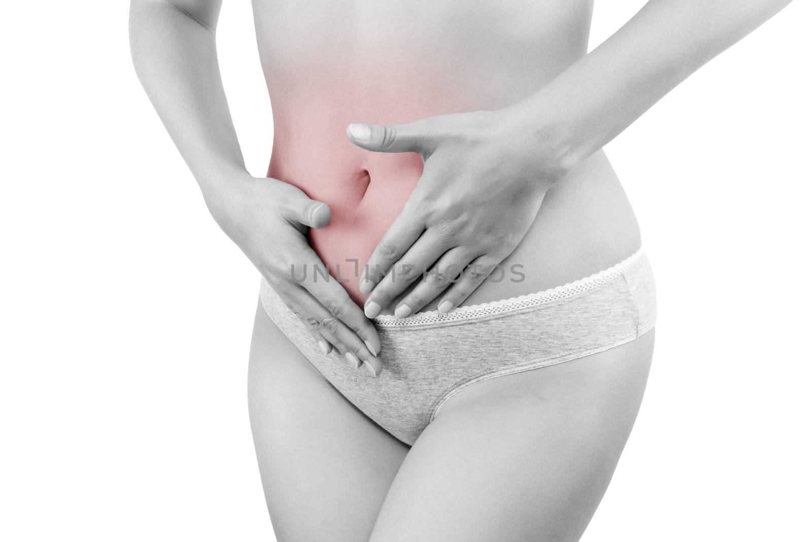 Stomach pain. Beautiful woman touching her belly in grey panties isolated on white background. Menstruation, period, pregnancy. Feminine health problems.