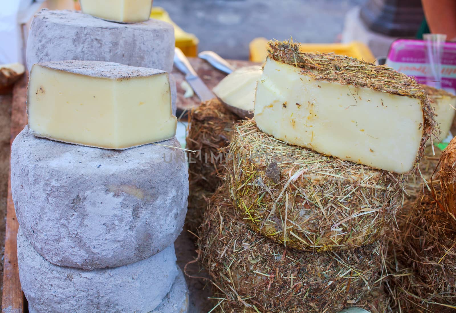 Italian cheeses covered in a layer of hay or cinder
