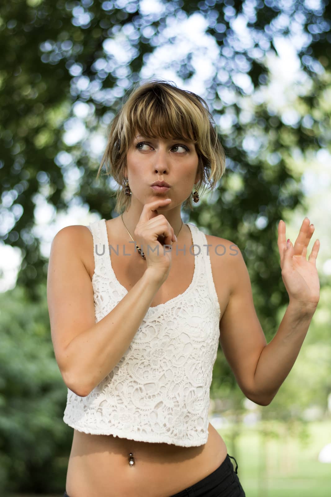  Attractive blonde young woman with funny expression  by artofphoto